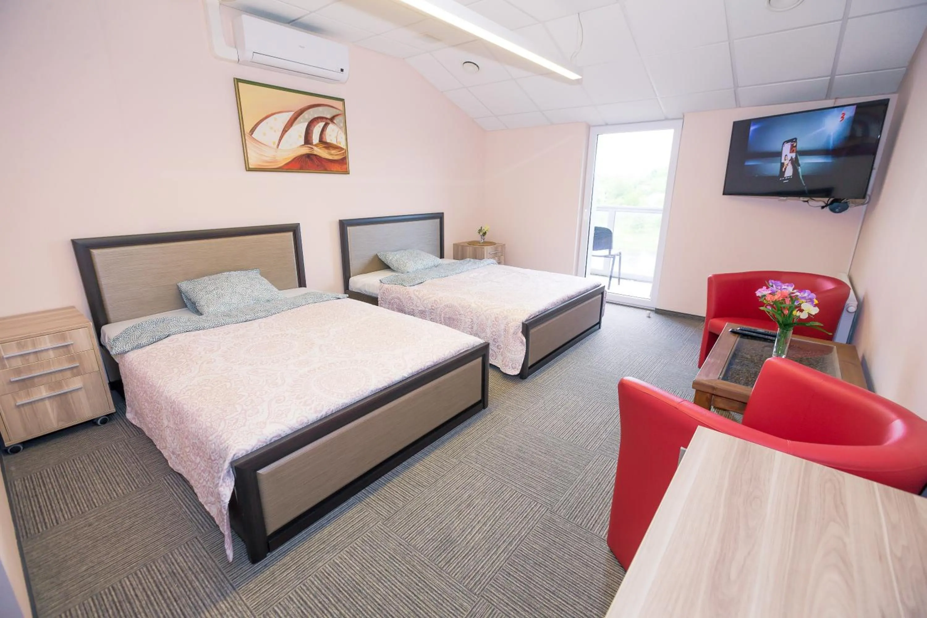 Communal lounge/ TV room, Bed in Rezidencija "Prieplauka"