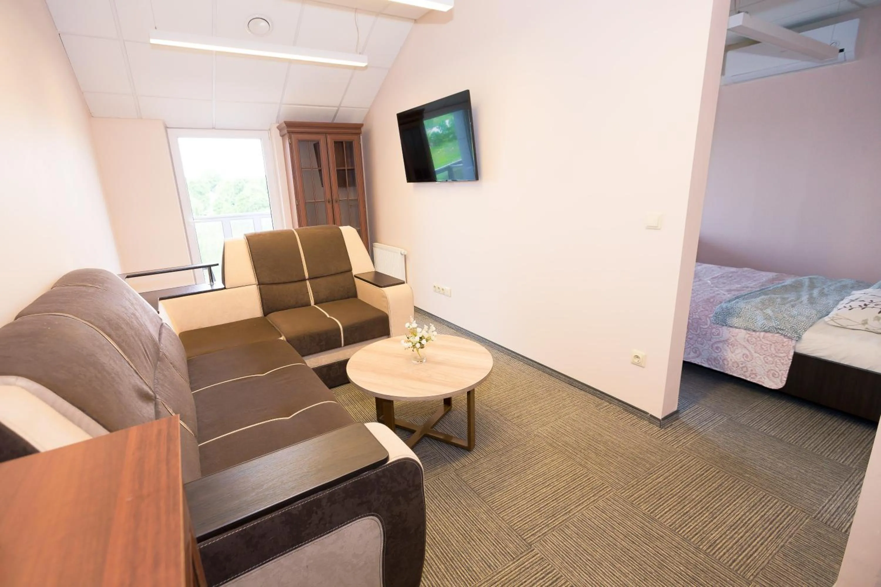 Communal lounge/ TV room, Bed in Rezidencija "Prieplauka"