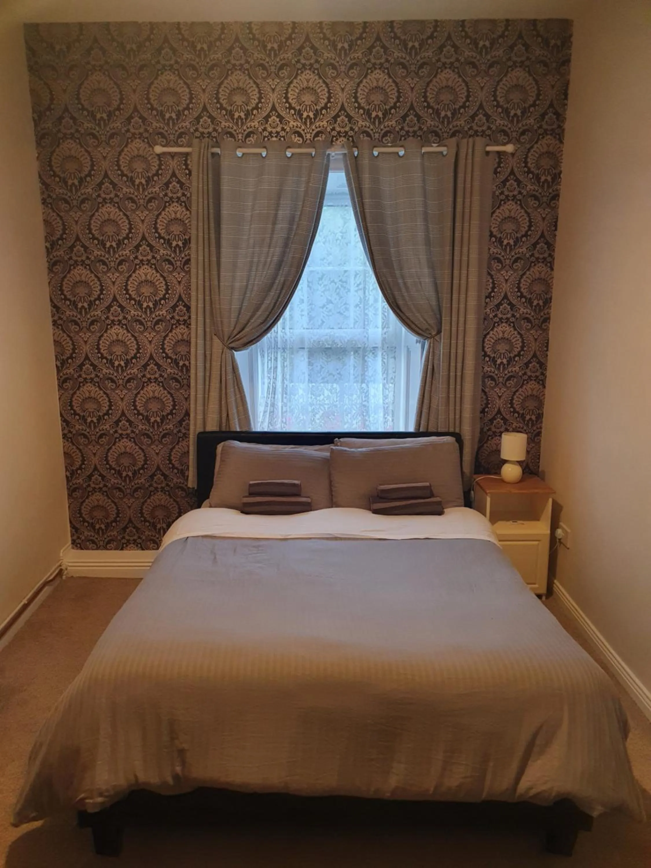 Bed in Gordon's Guesthouse