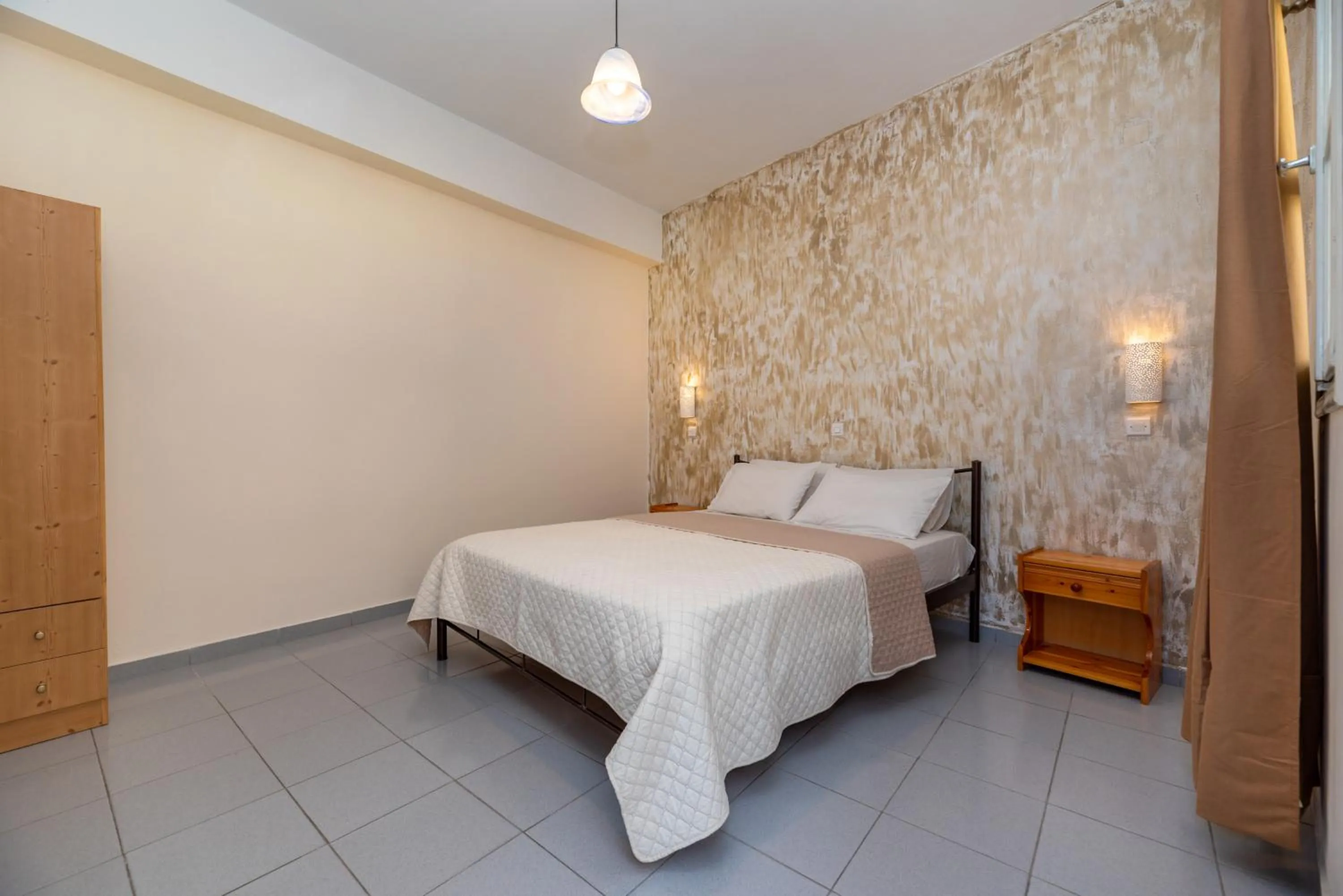 Bed in Onar Rooms & Studios