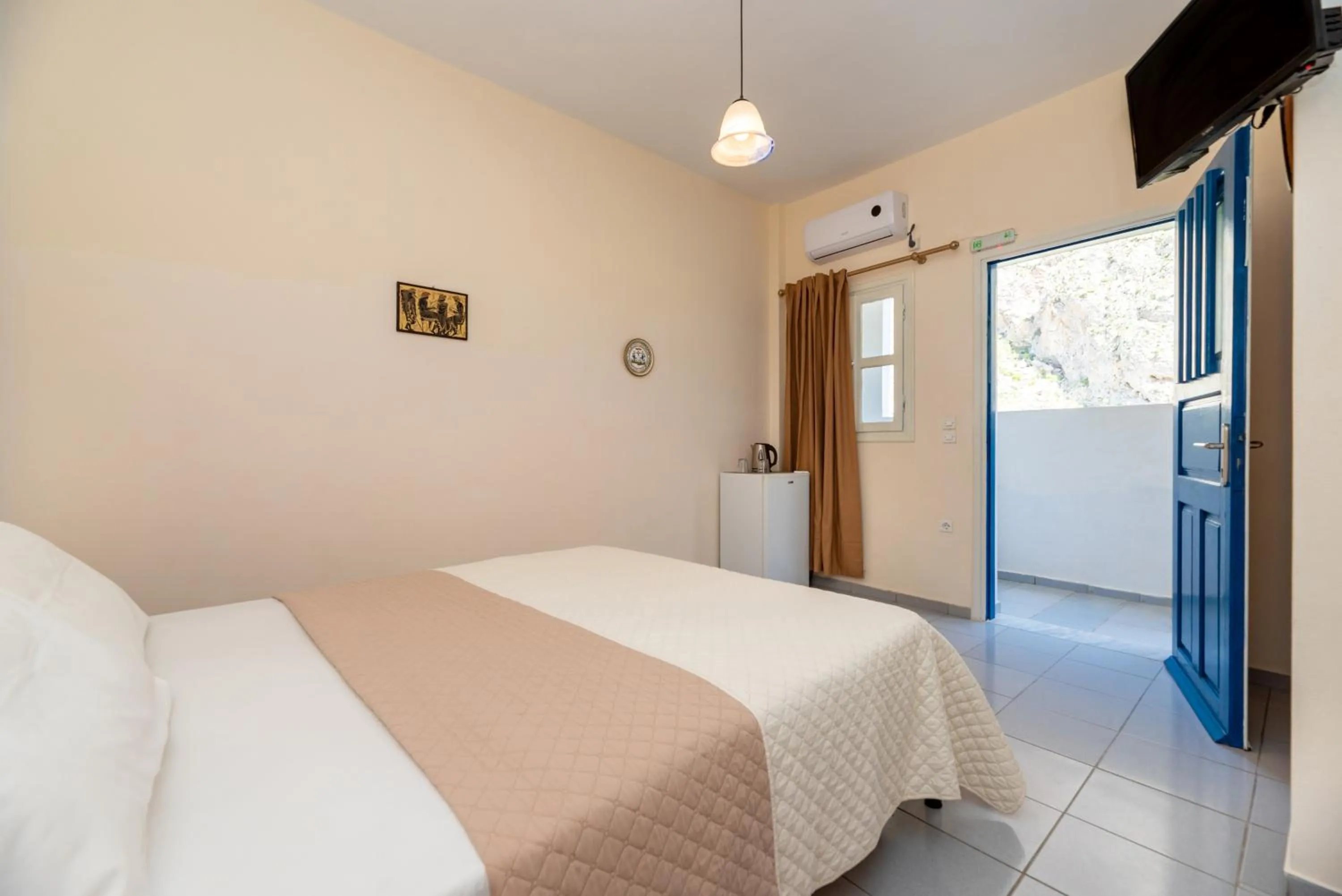 Bed in Onar Rooms & Studios