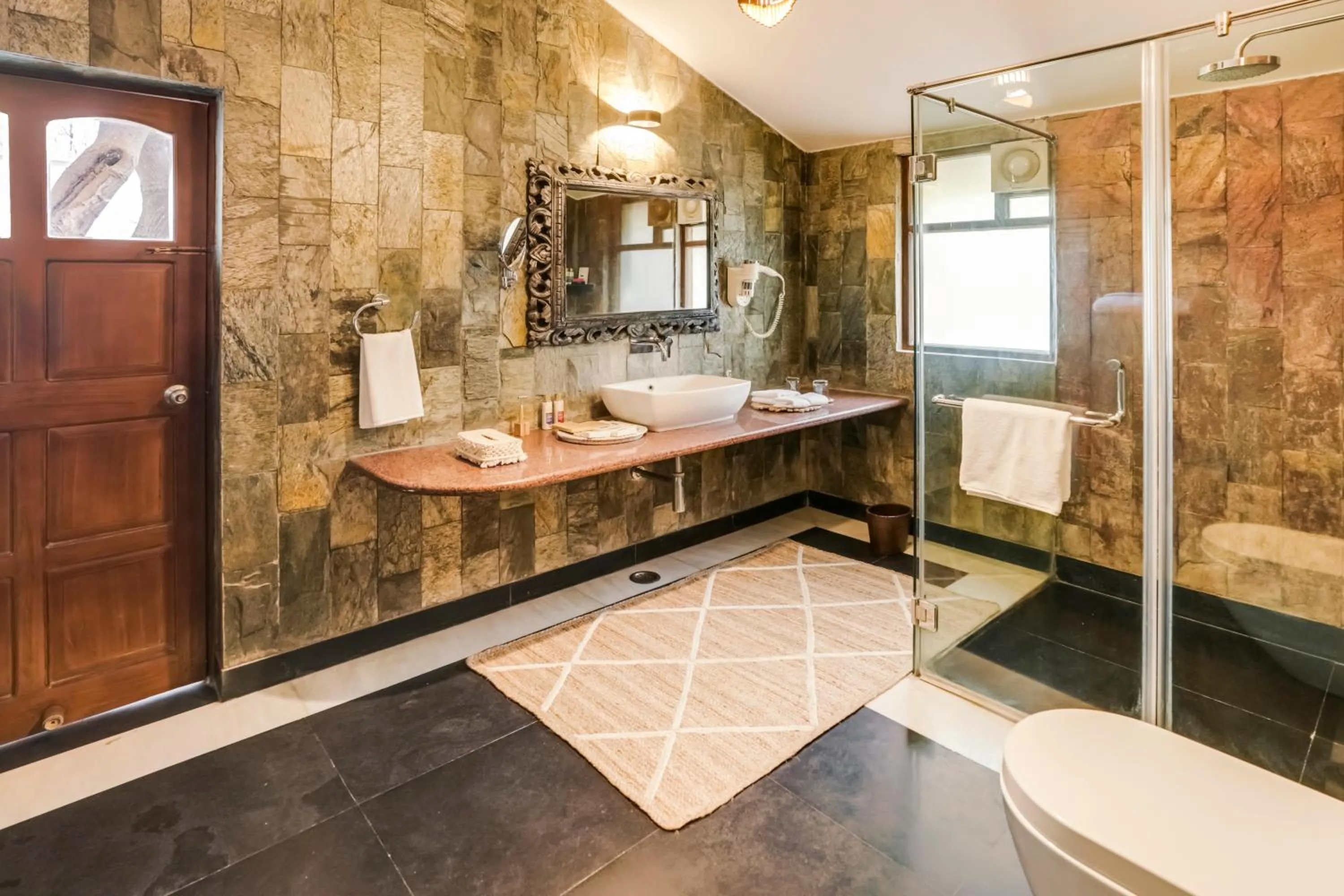 Shower in The Tree House Resort, A Club Mahindra Associate