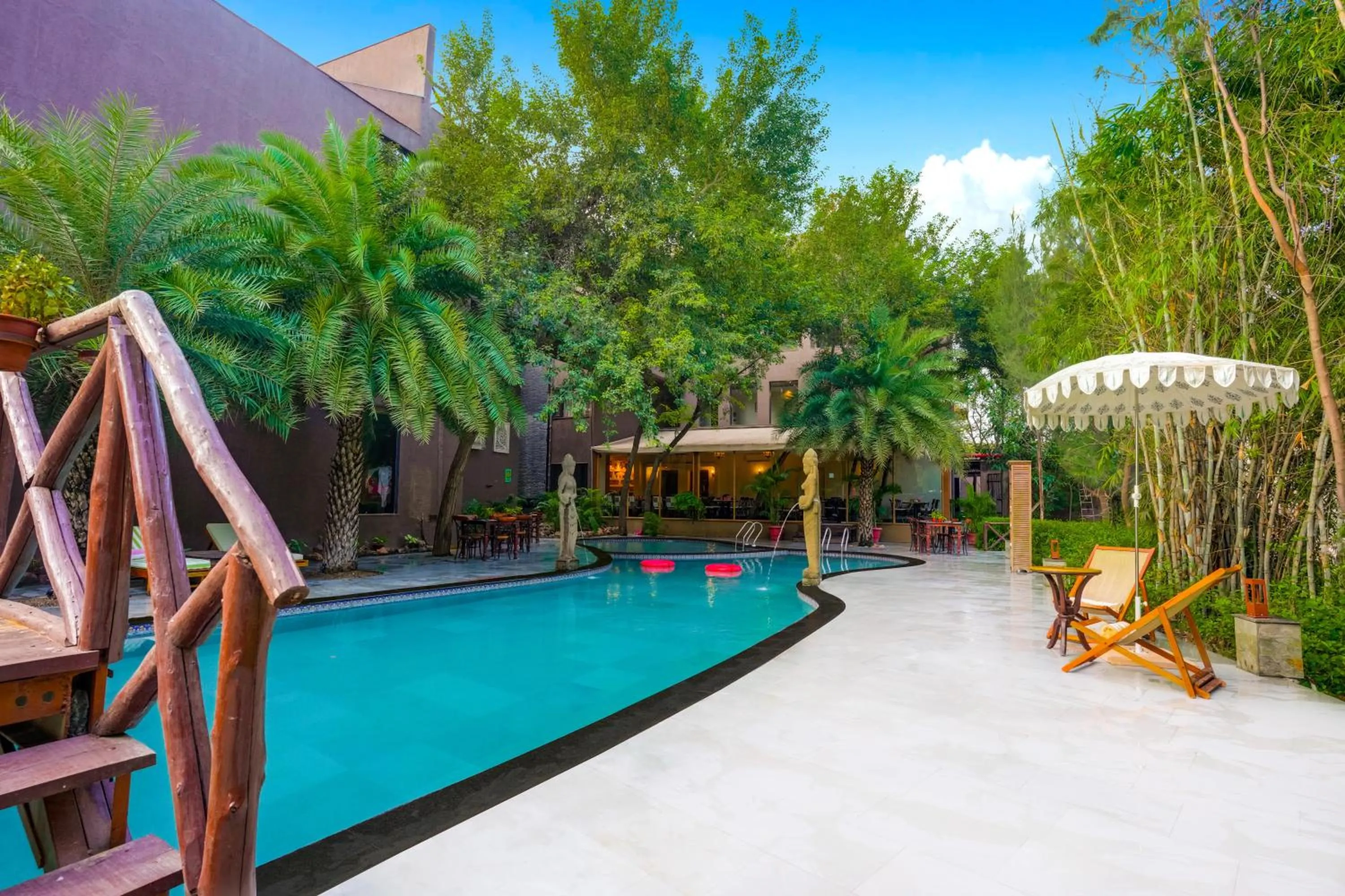 Swimming pool in The Tree House Resort, A Club Mahindra Associate