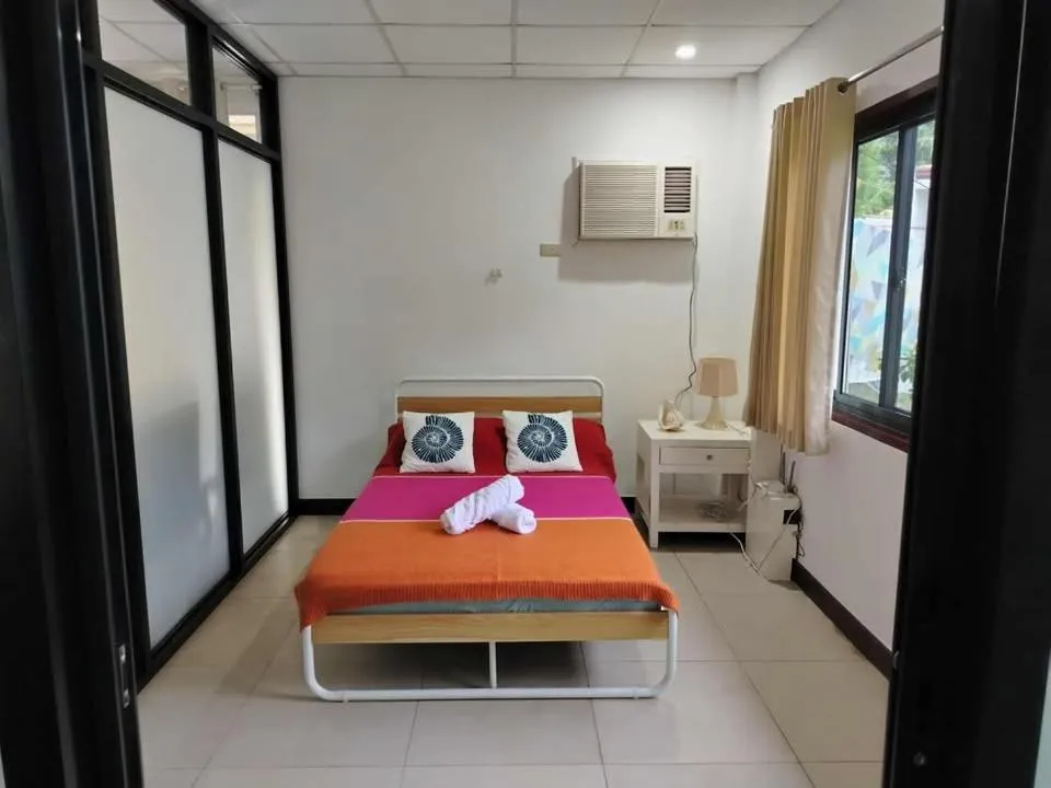 Bed in 1888 Beach Resort