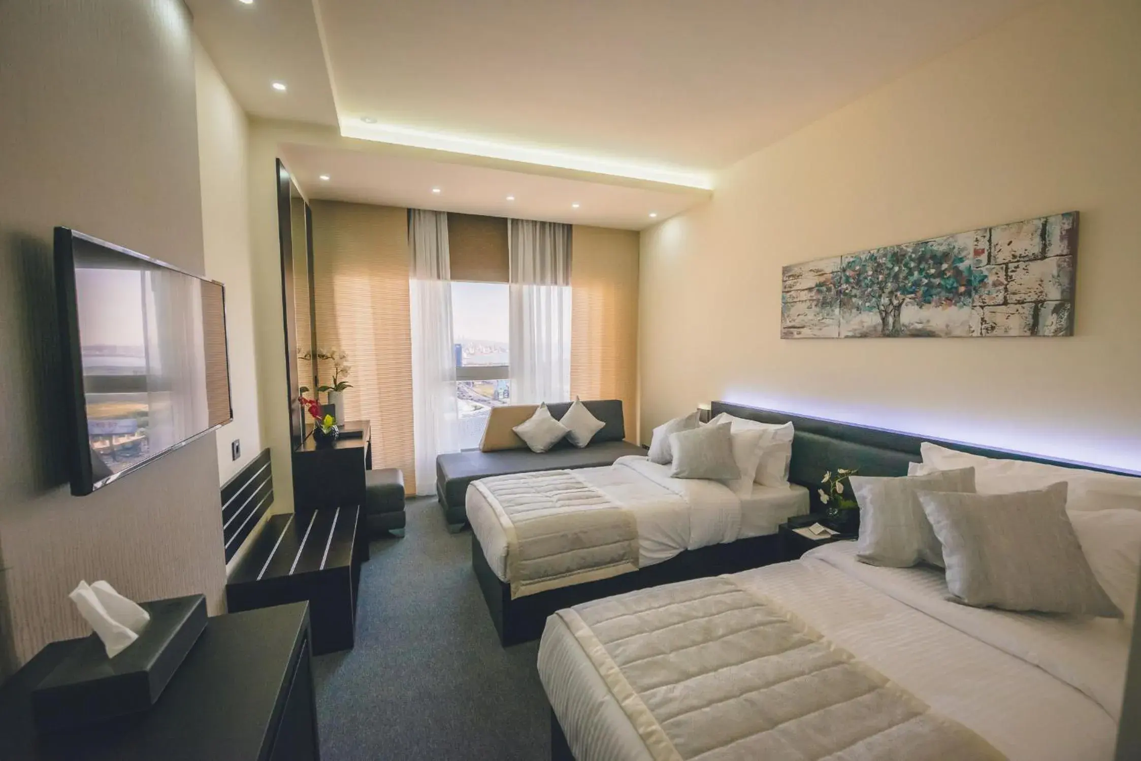 Seating area, Bed in Louis V Hotel Beirut Seating area, Bed in Louis V Hotel Beirut