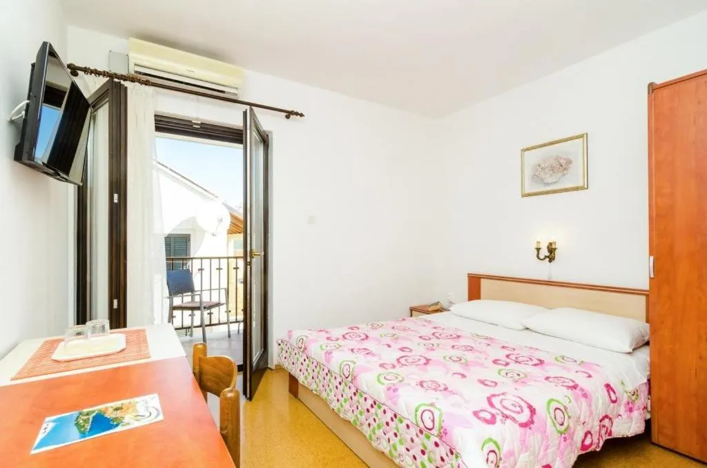 Bed in Cina Apartments