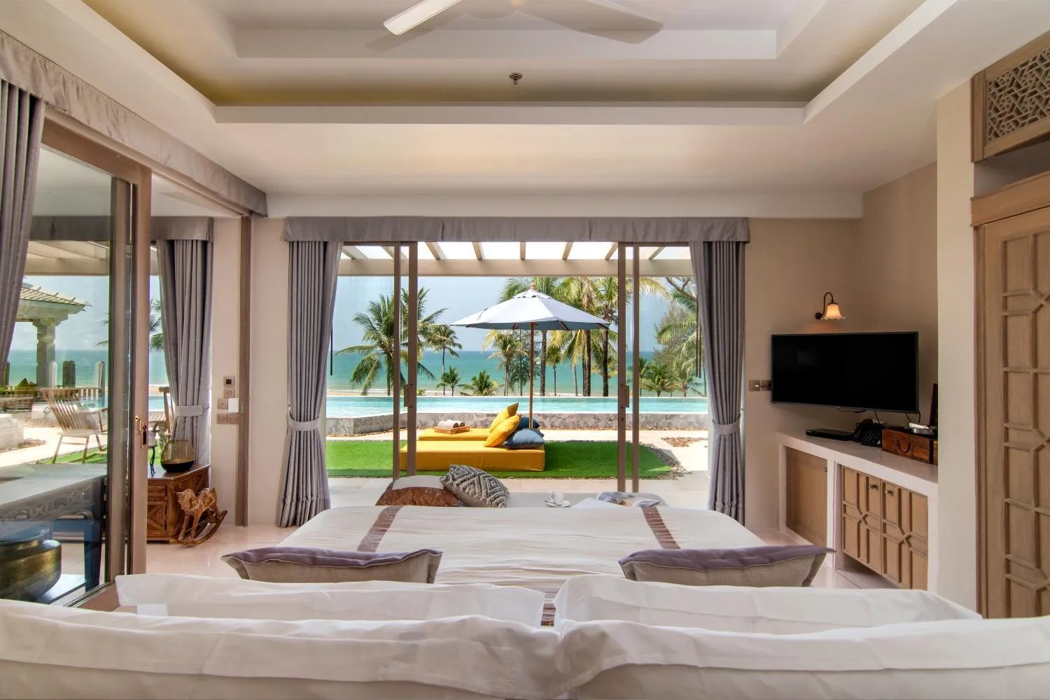 Bed in Devasom Khao Lak Beach Resort & Villas