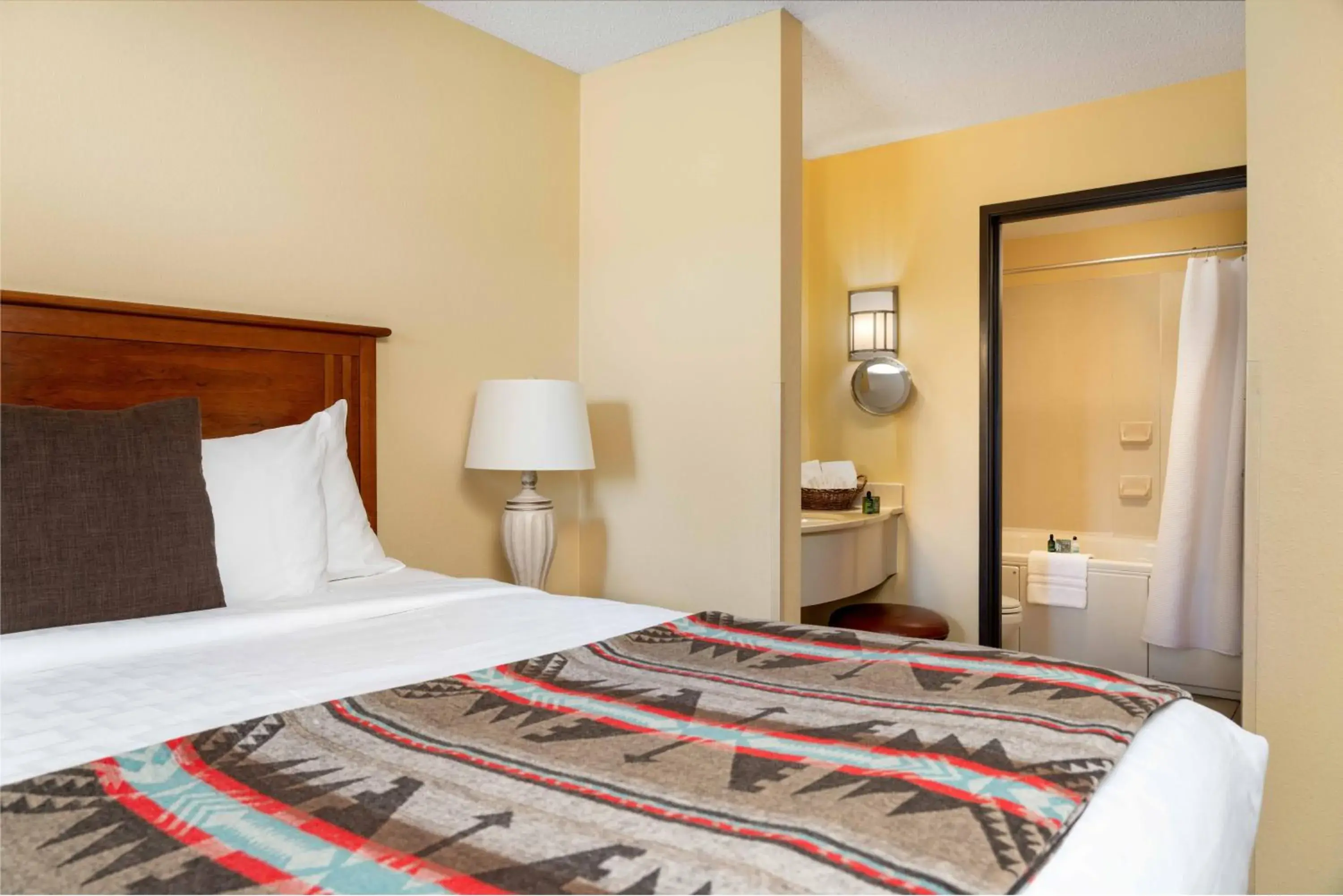 Bed in MCM Elegante Lodge & Resorts Bed in MCM Elegante Lodge & Resorts