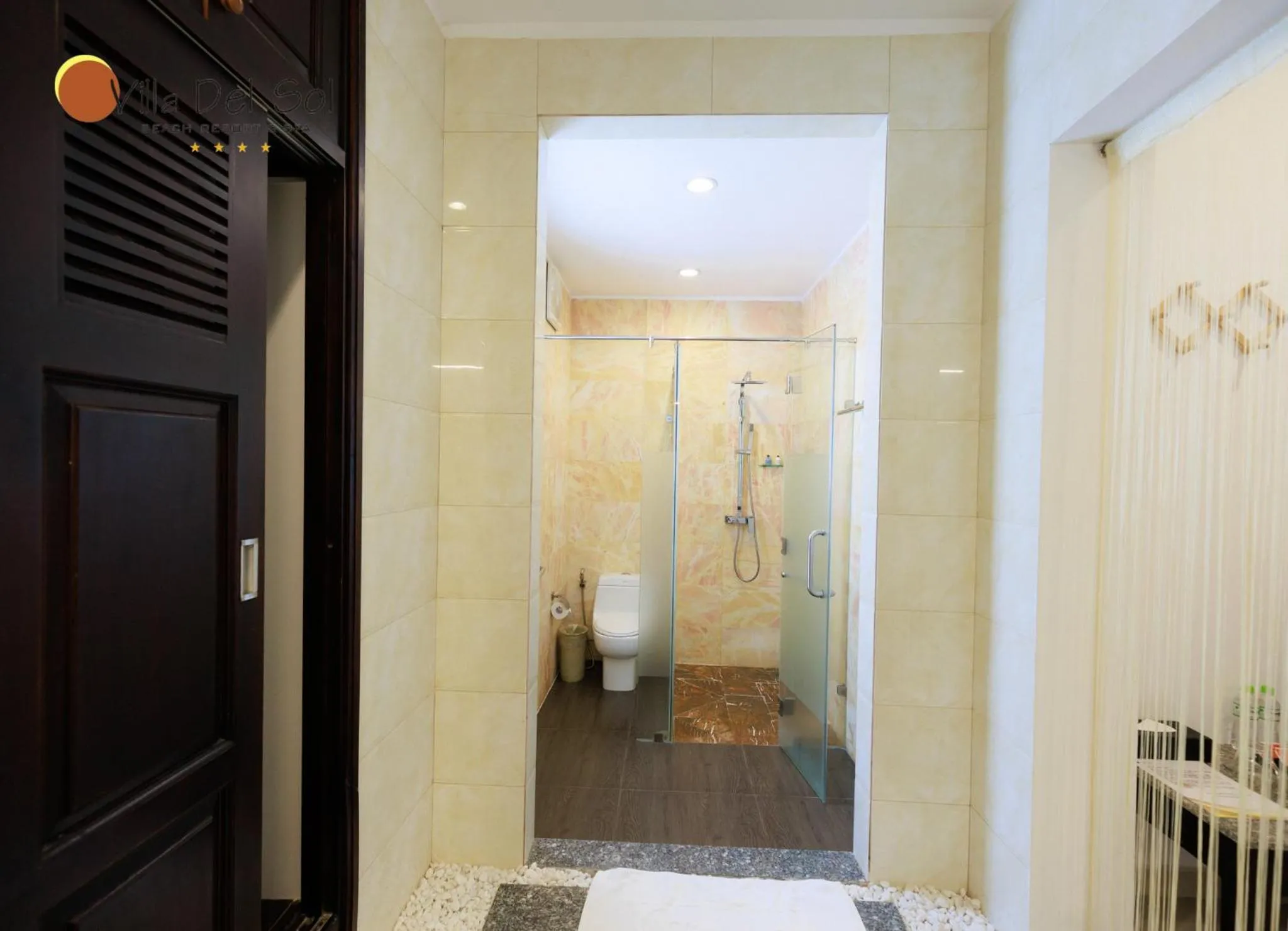 Toilet in Villa Del Sol Beach Resort & Spa