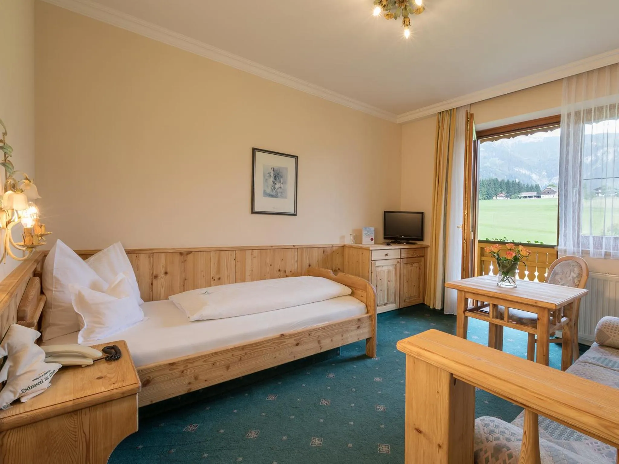 Photo of the whole room, Bed in Landhotel Häuserl im Wald