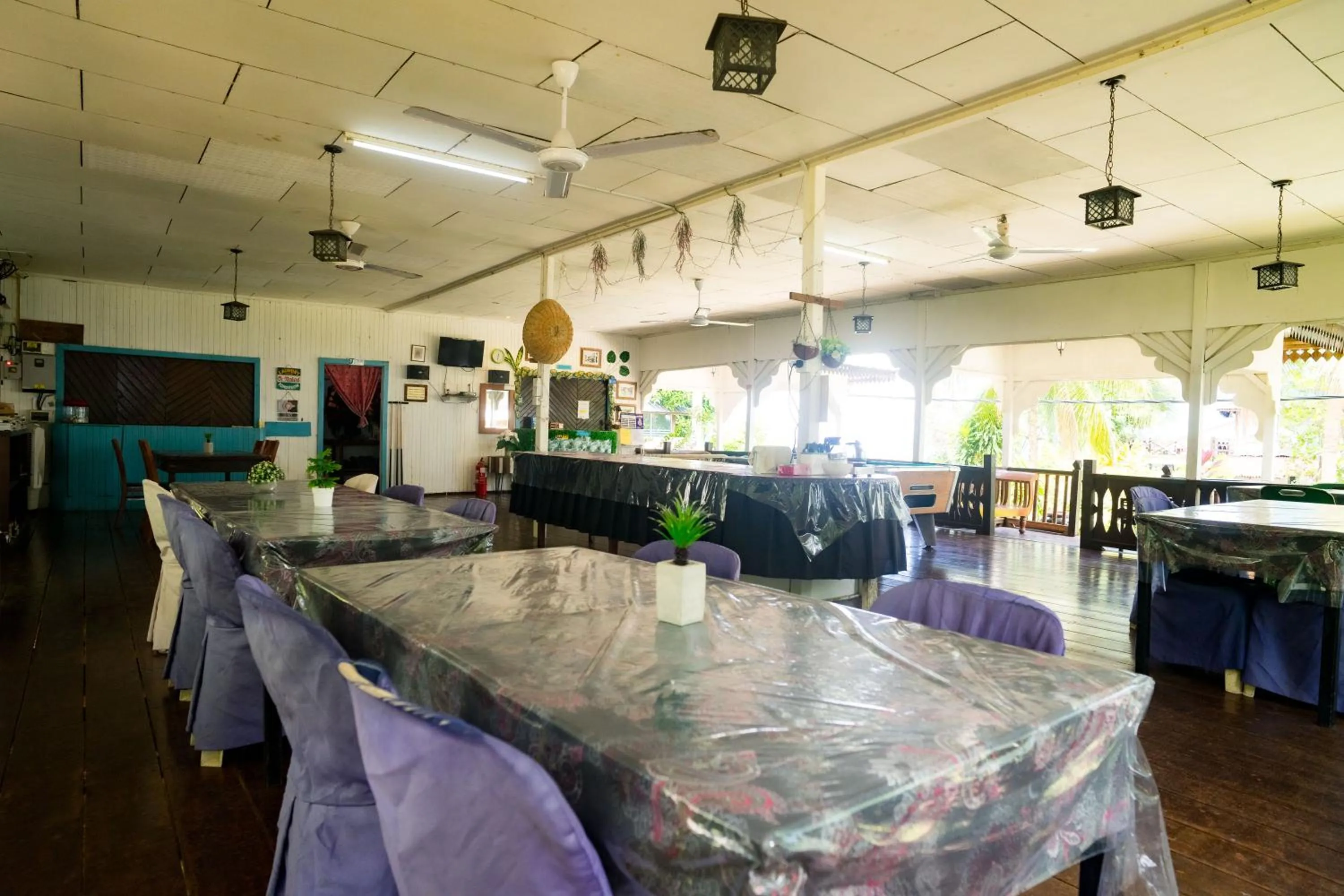 Communal lounge/ TV room in Impian Inn