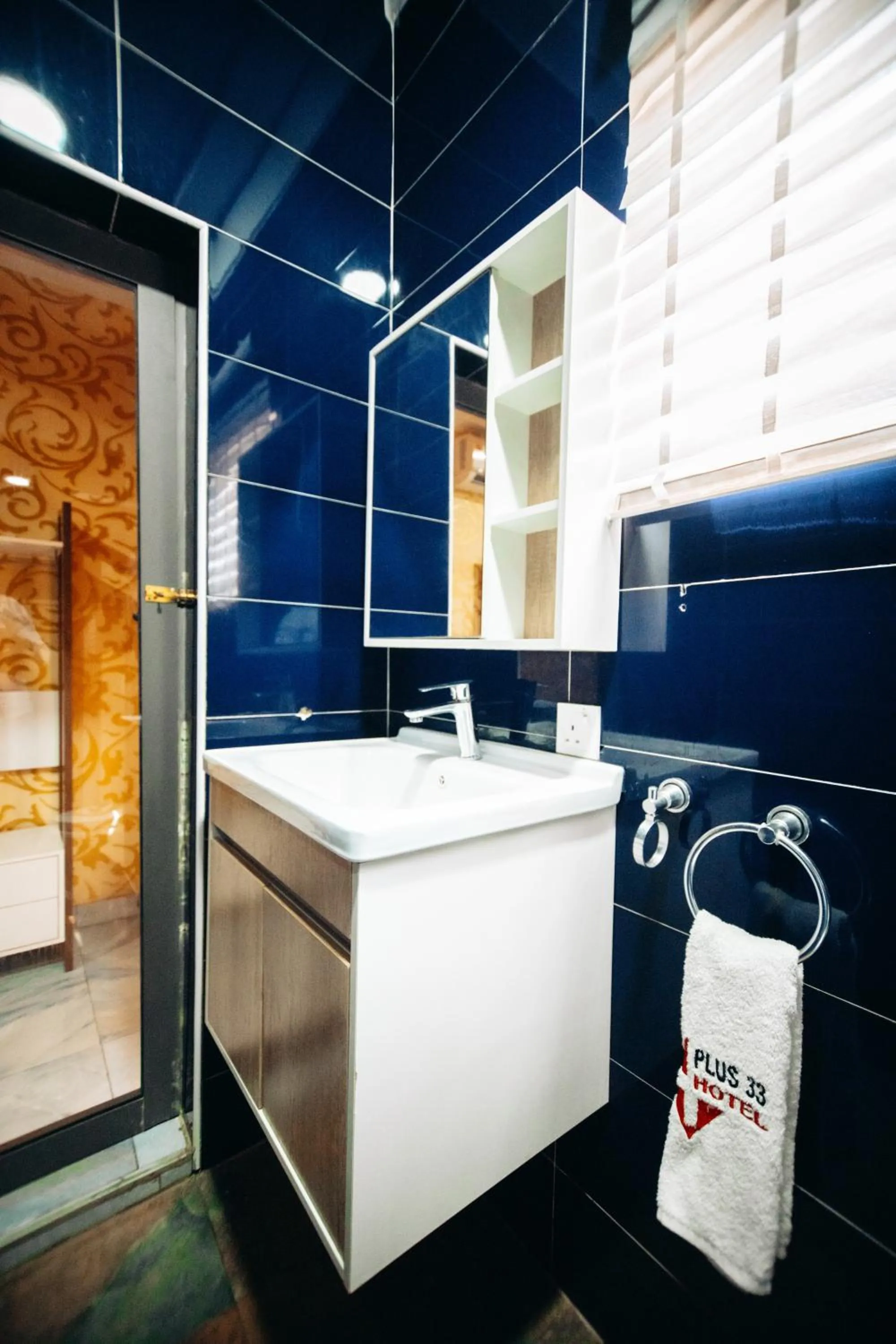 Shower in PLUS 33 HOTEL