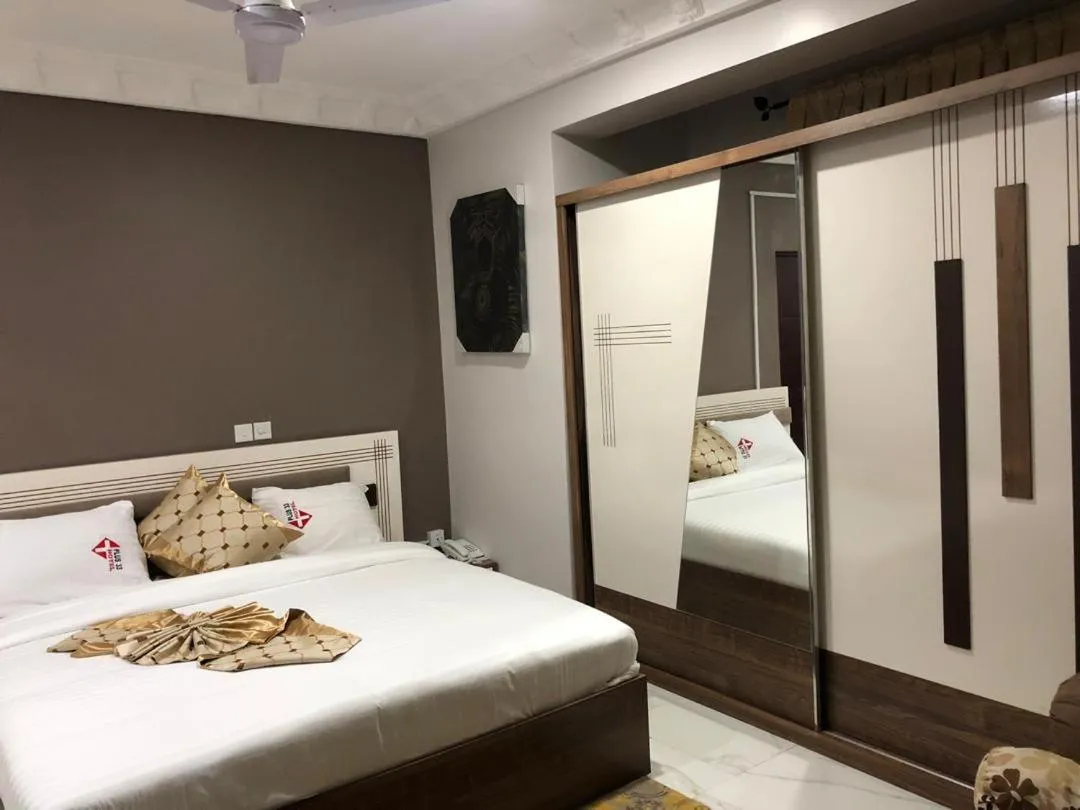 Bed in PLUS 33 HOTEL