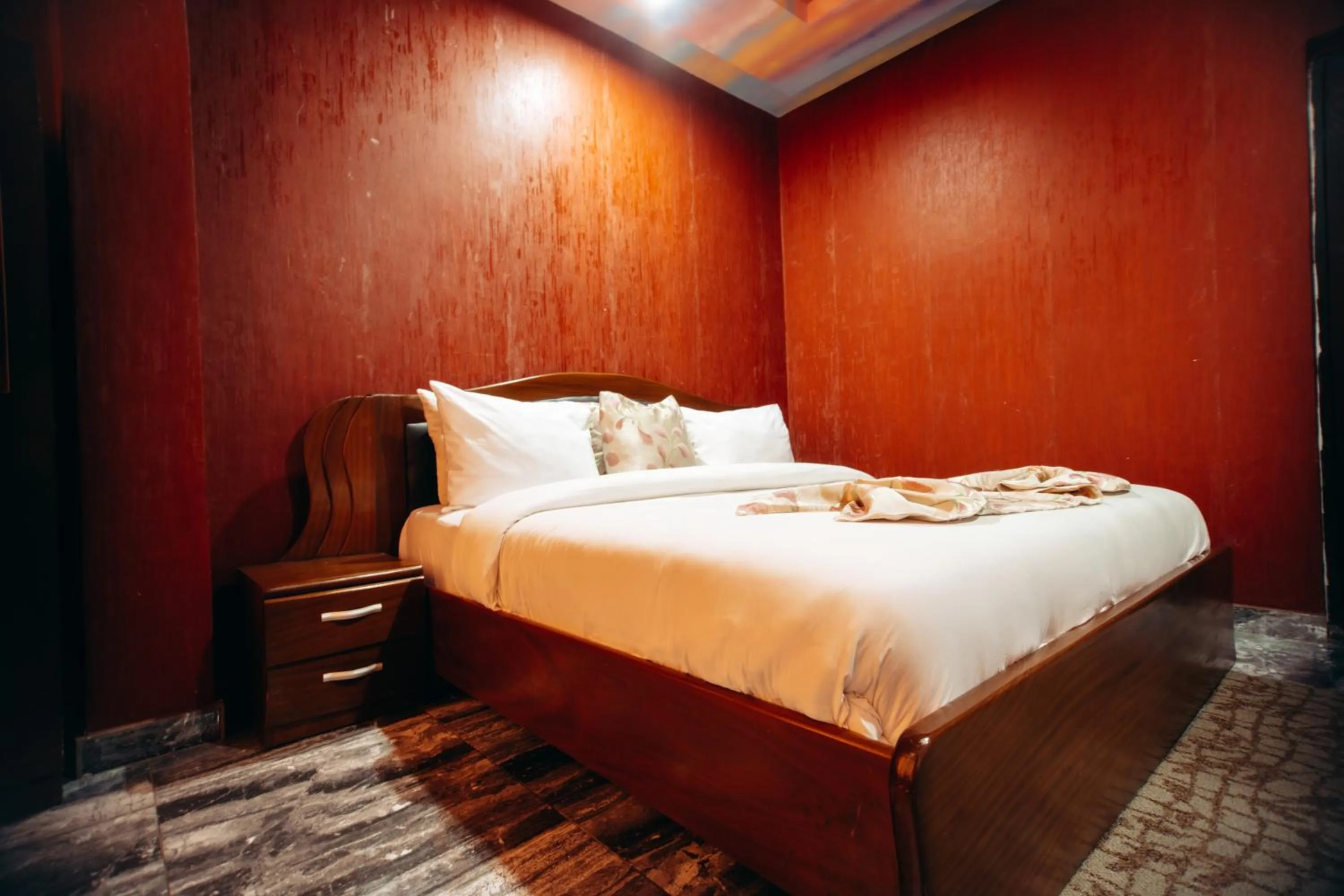 Bed in PLUS 33 HOTEL