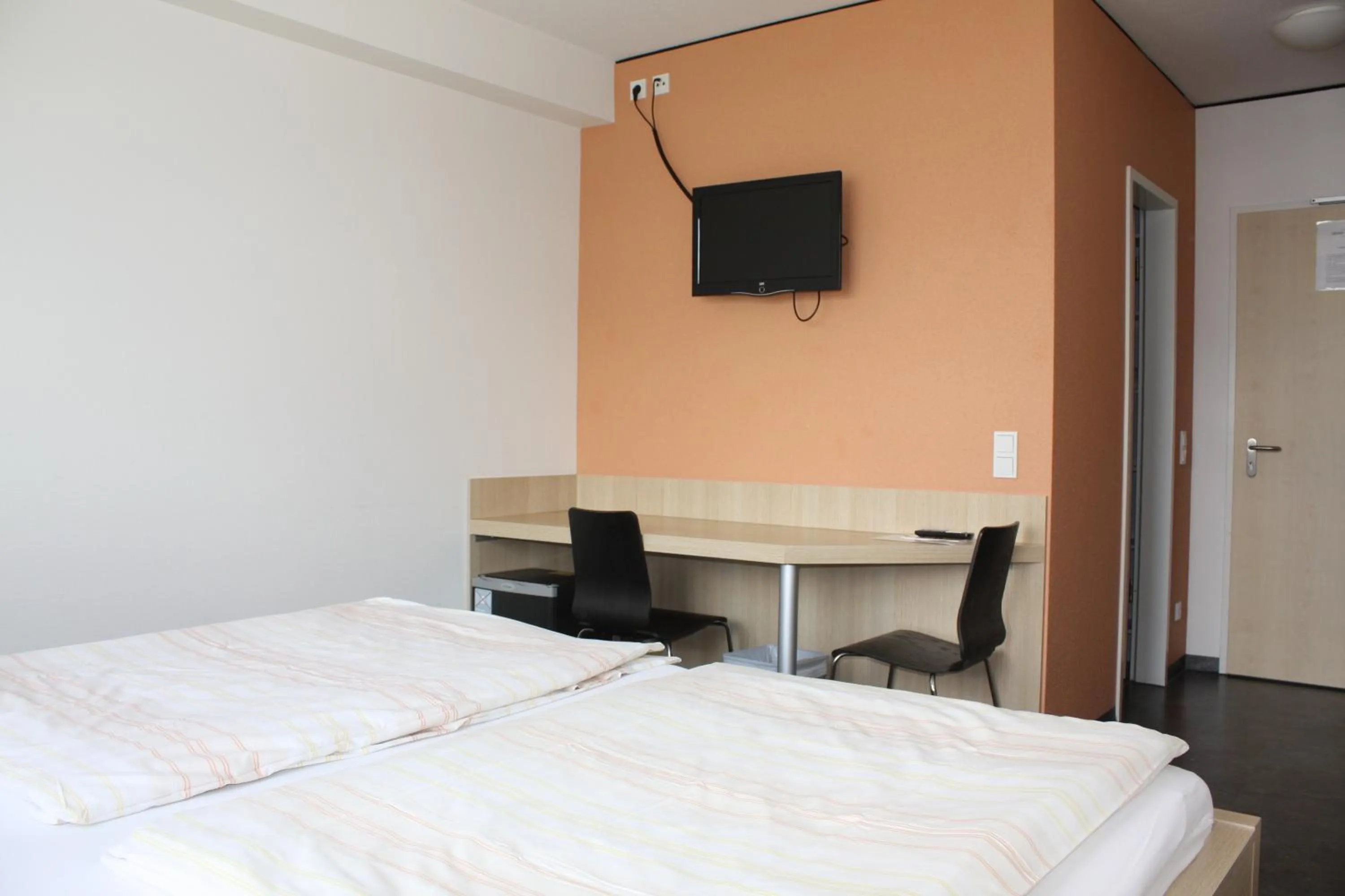 Bed in Hotel Grand Tour