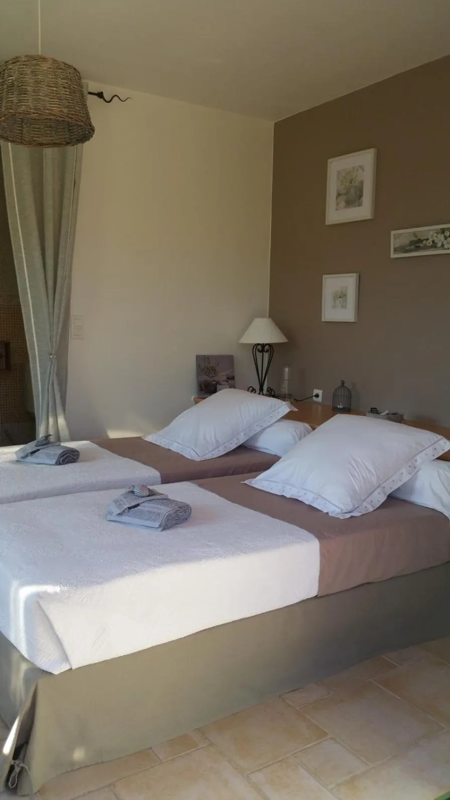 Bed in Le Petit Coin de Paradis