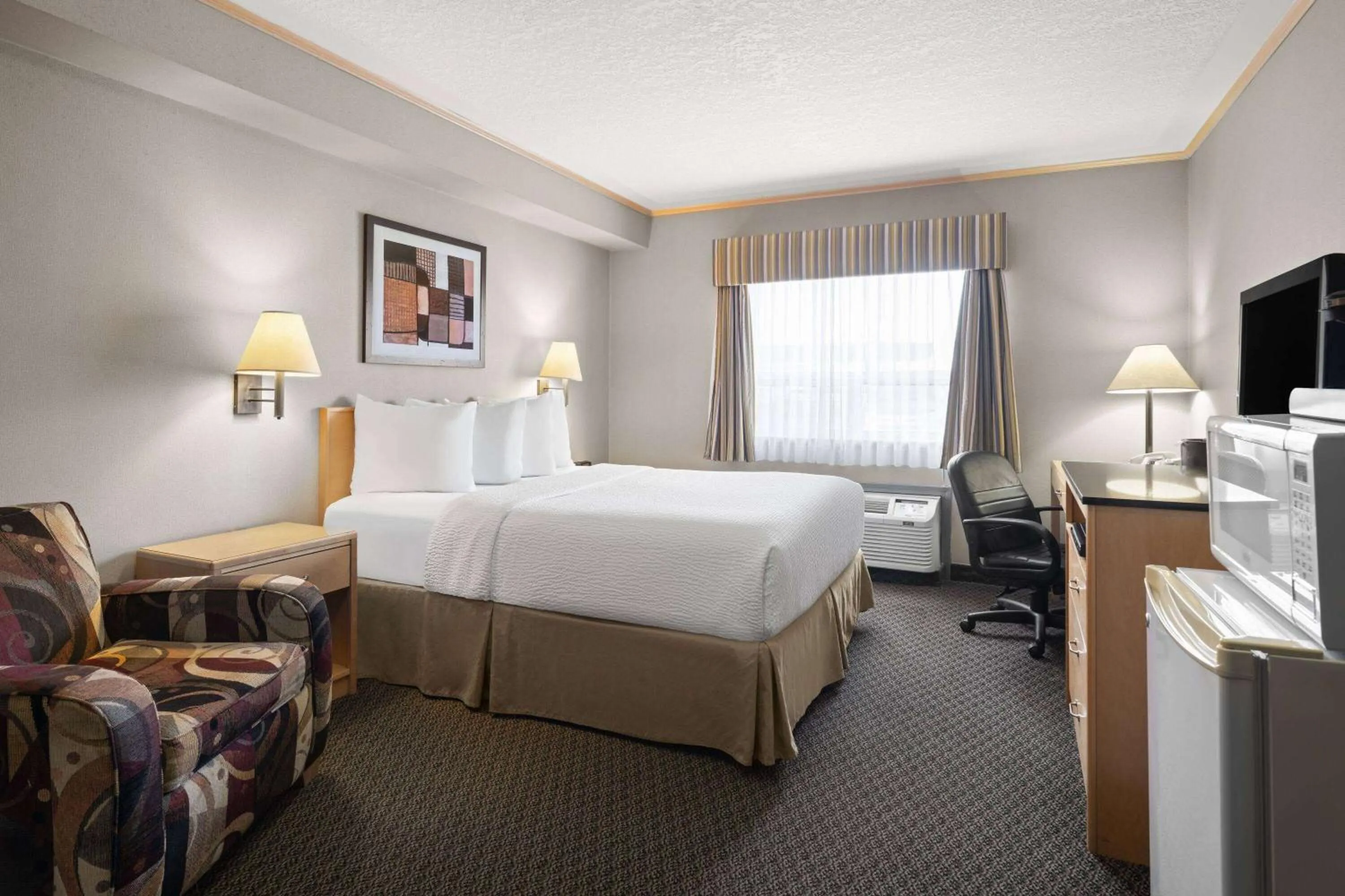 Photo of the whole room, Bed in Travelodge by Wyndham Fort McMurray