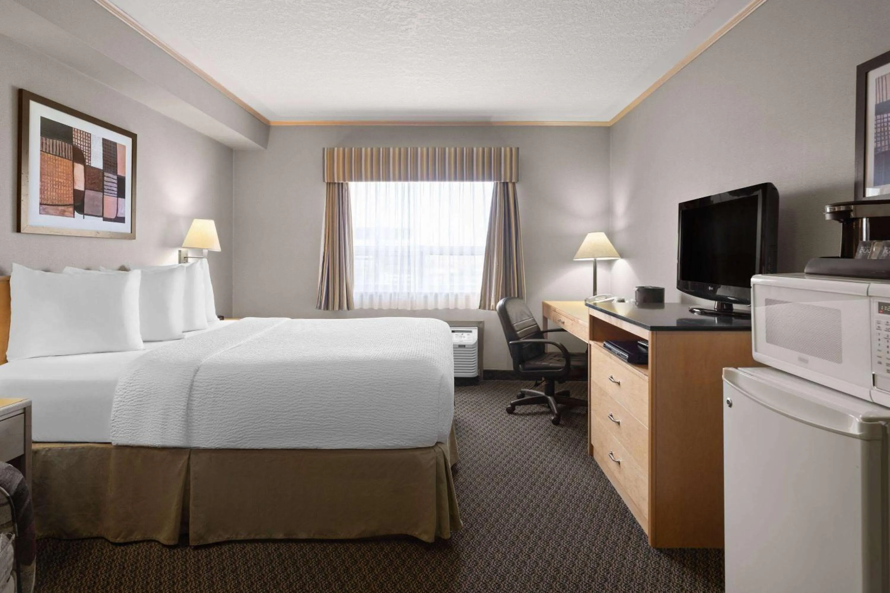 Photo of the whole room, Bed in Travelodge by Wyndham Fort McMurray