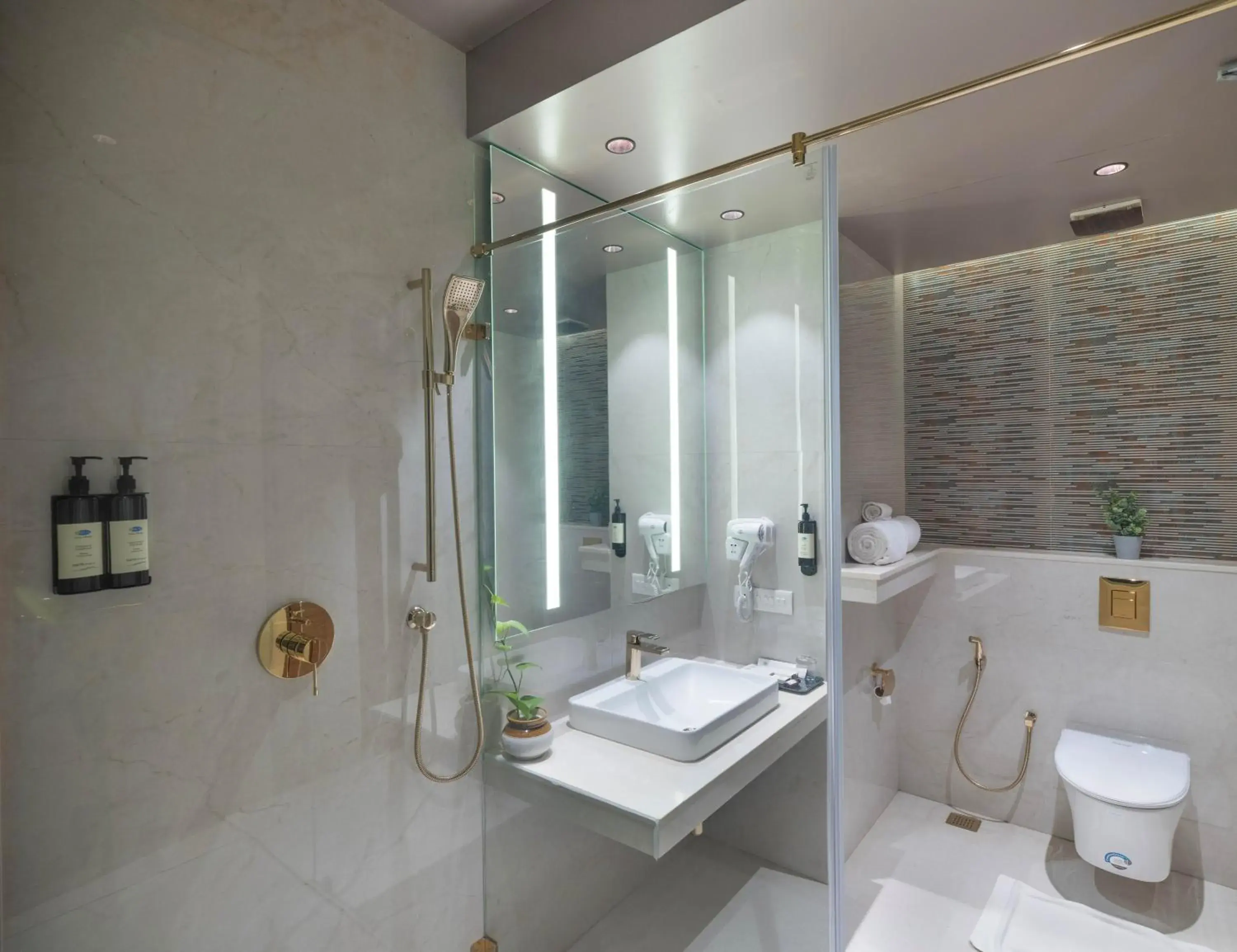 Bathroom in Uday Suites - The Airport Hotel Bathroom in Uday Suites - The Airport Hotel