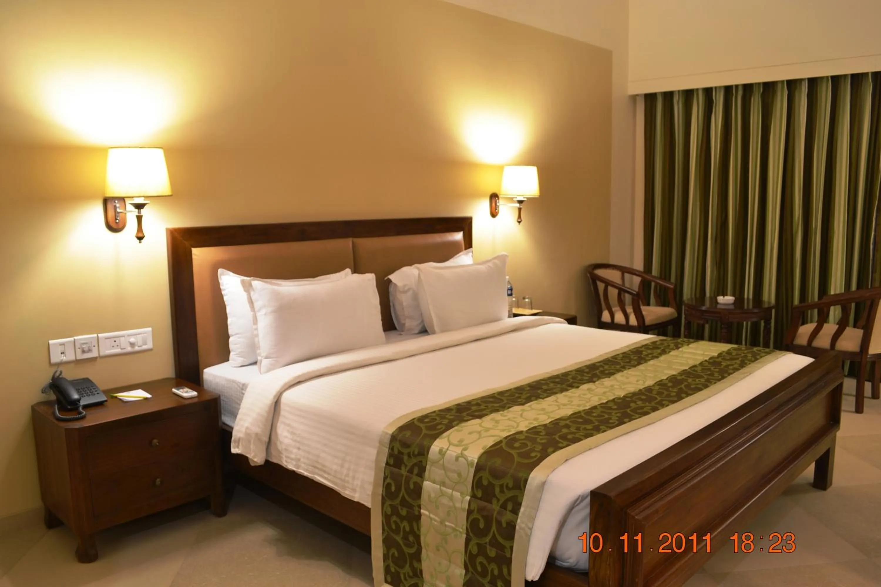 Bed in Uday Suites - The Airport Hotel