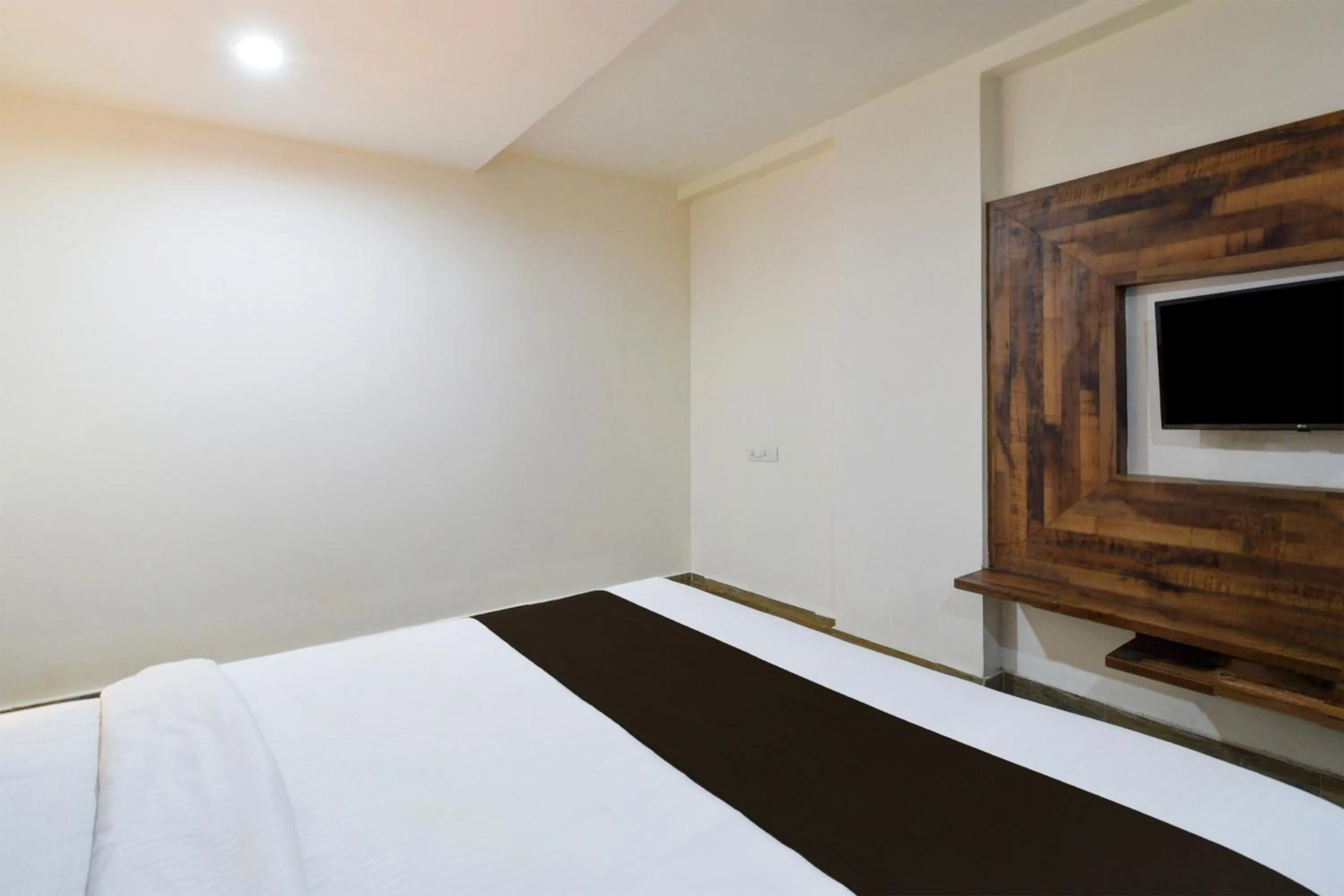 Bedroom, Bed in Super Townhouse Vanasthalipuram Formerly Hotel Surabhi