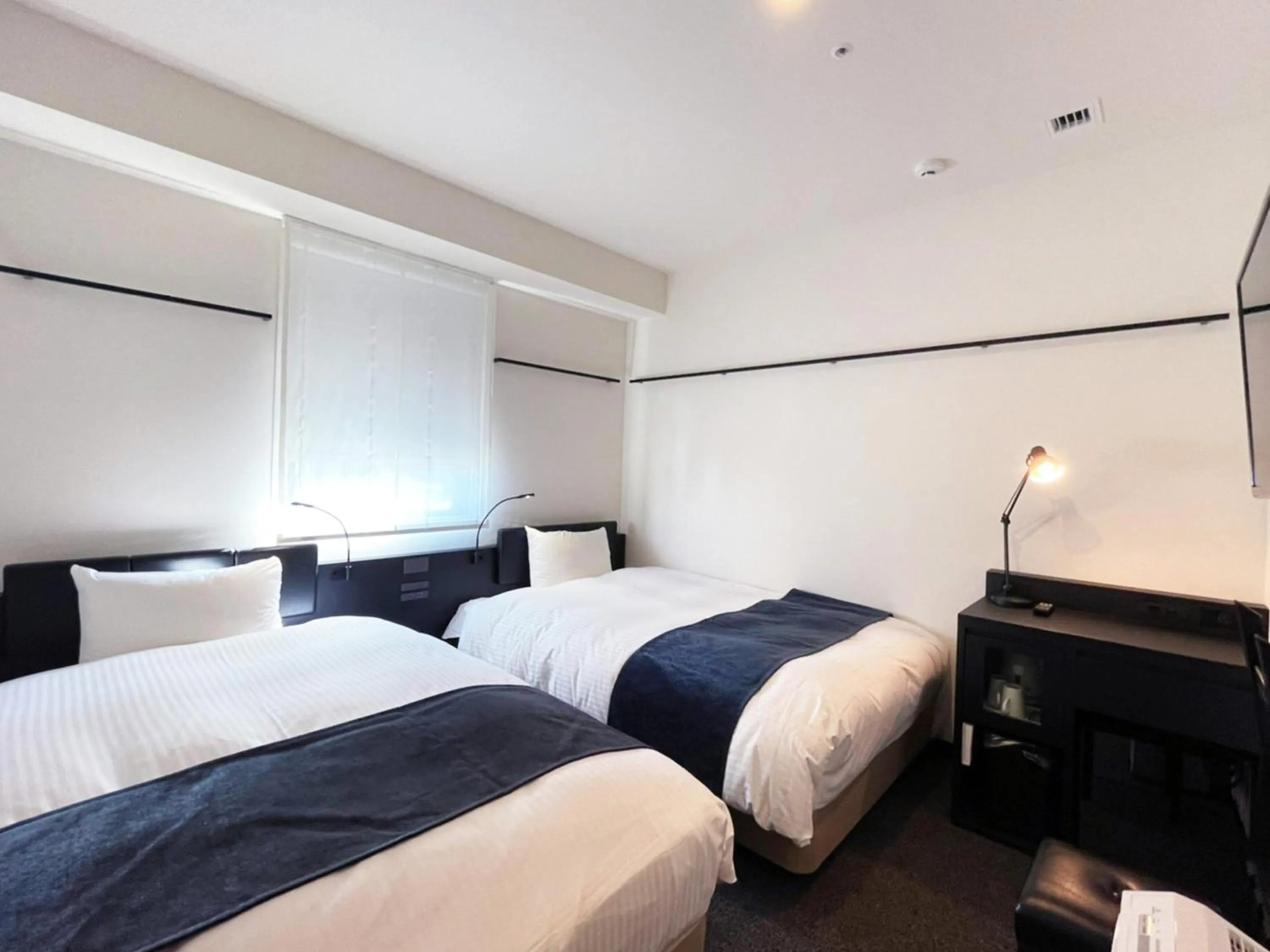 Bed in HOTEL SUI KANDA by ABEST