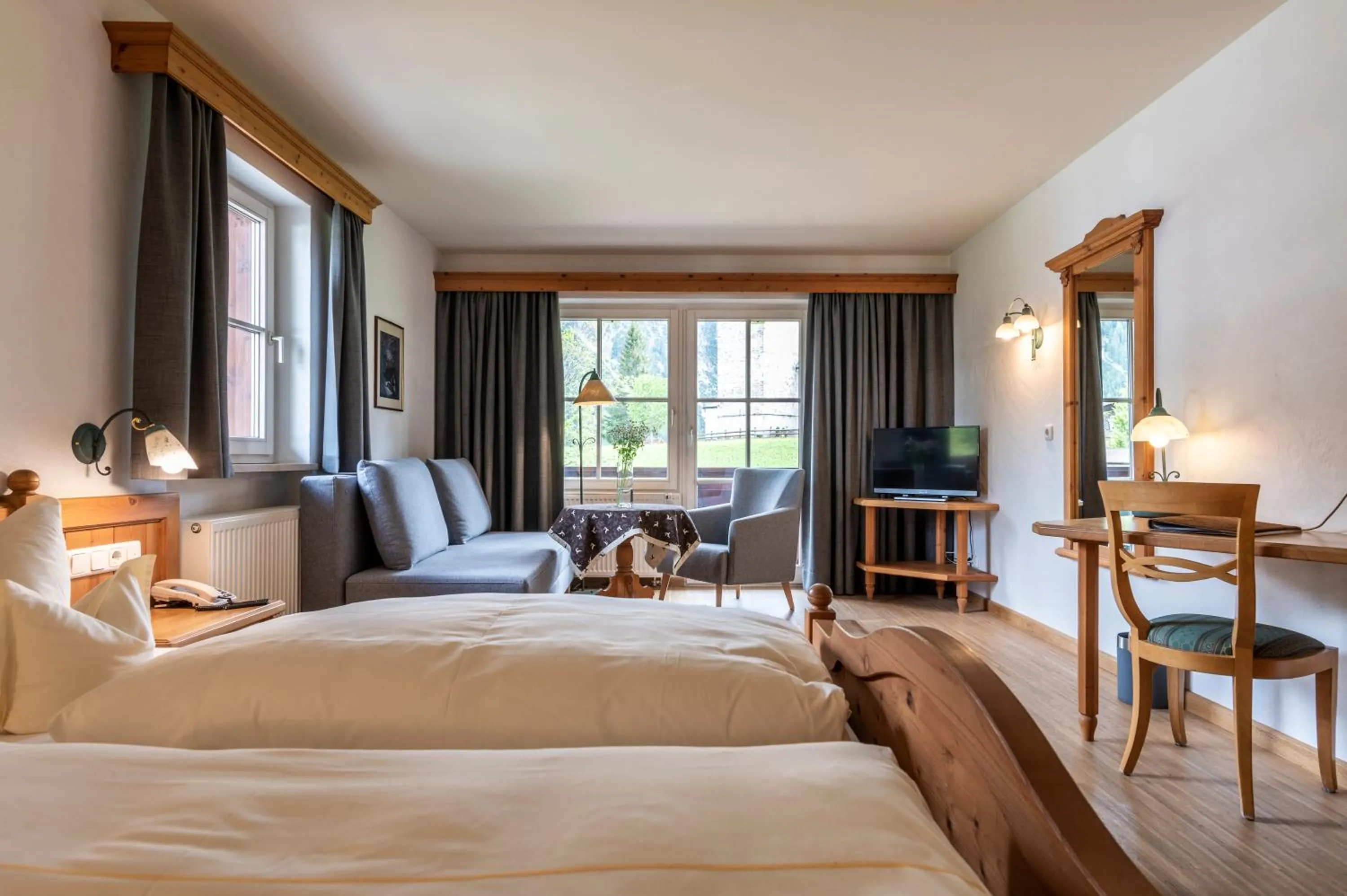 Photo of the whole room, Bed in Naturhotel Lärchenhof