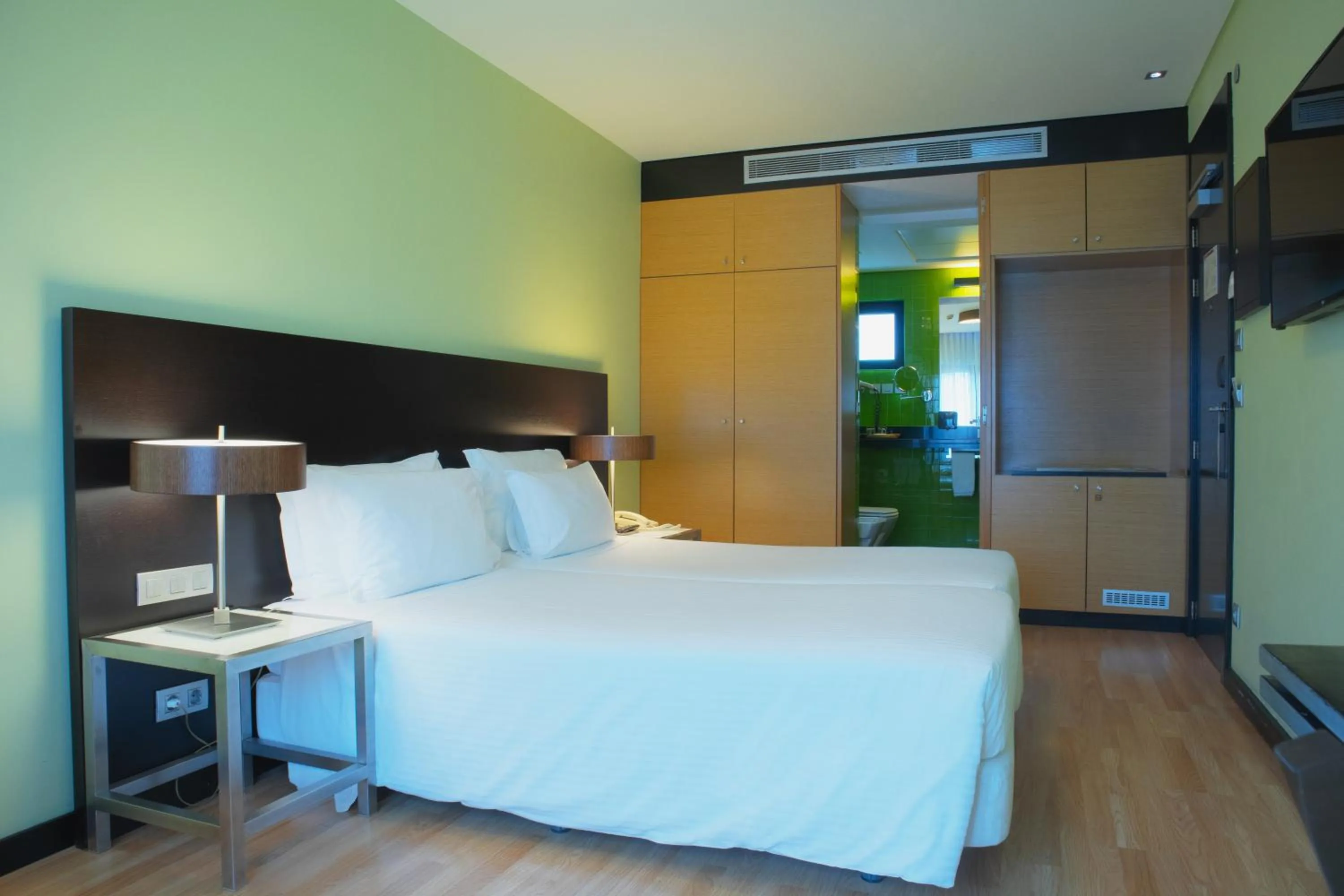 Bed in SANA Capitol Hotel