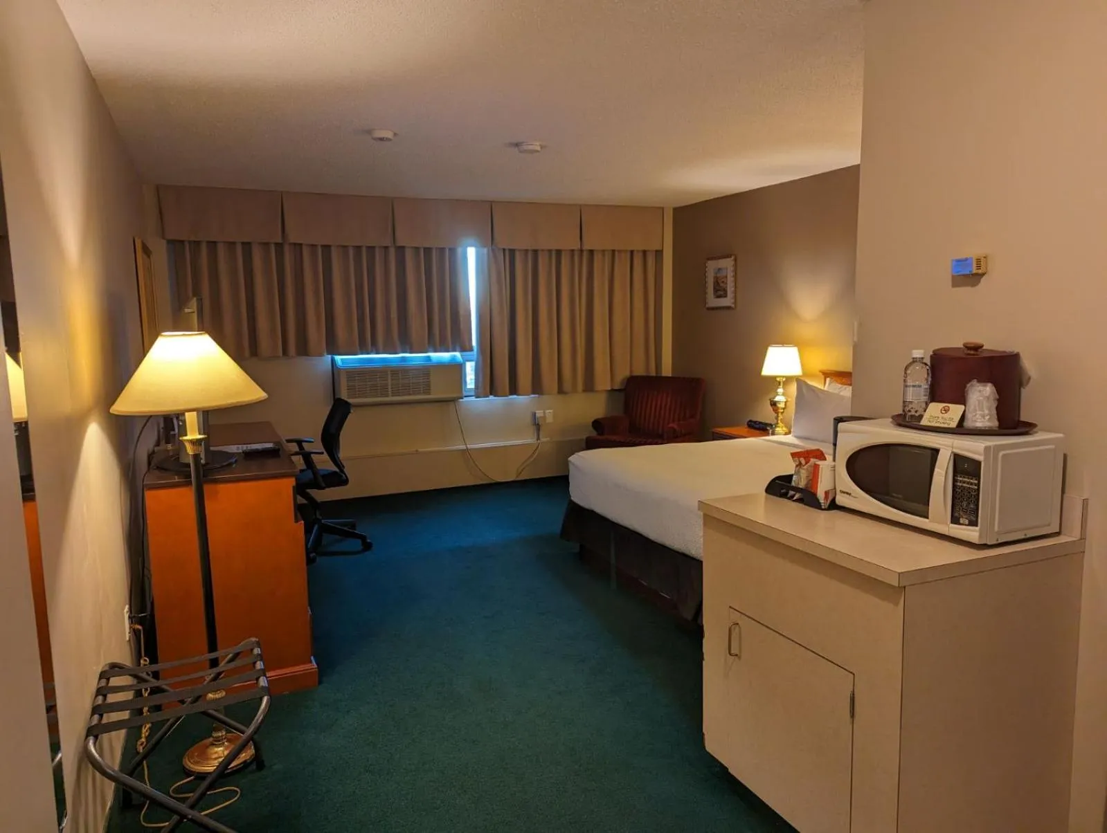 Photo of the whole room, Bed in Nomad Hotel & Suites