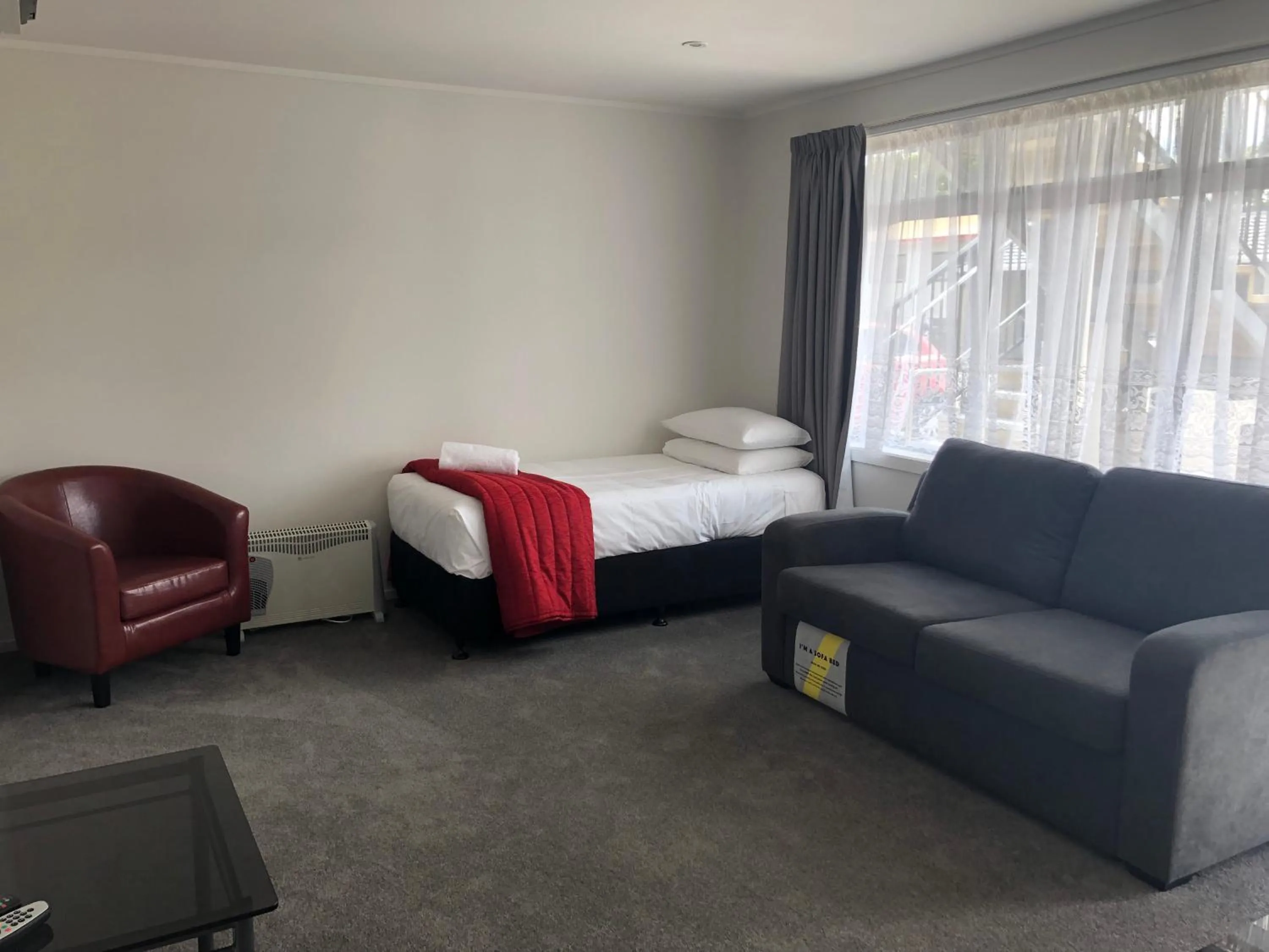 Bed in Ambassador Motor Inn