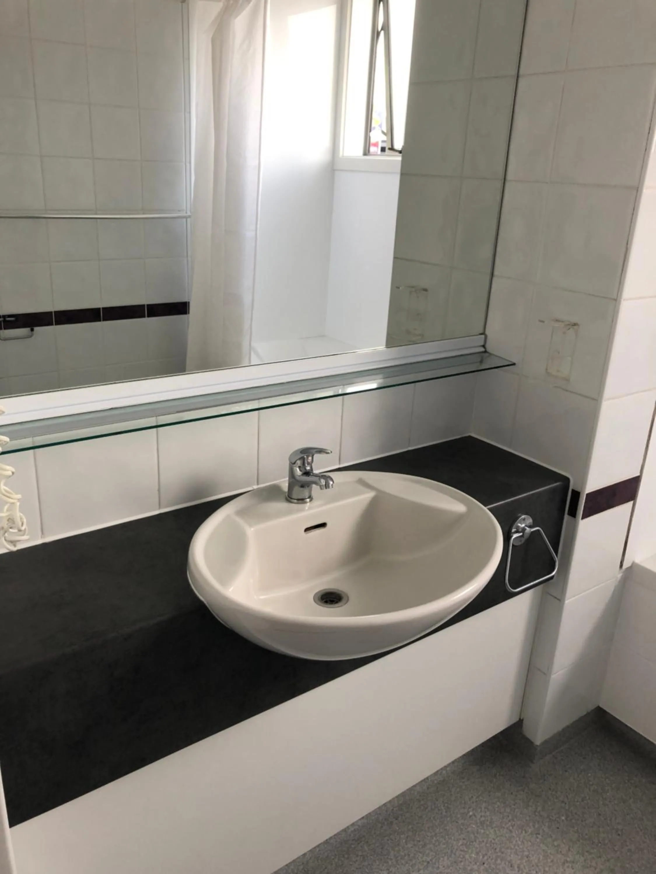 Bathroom in Ambassador Motor Inn