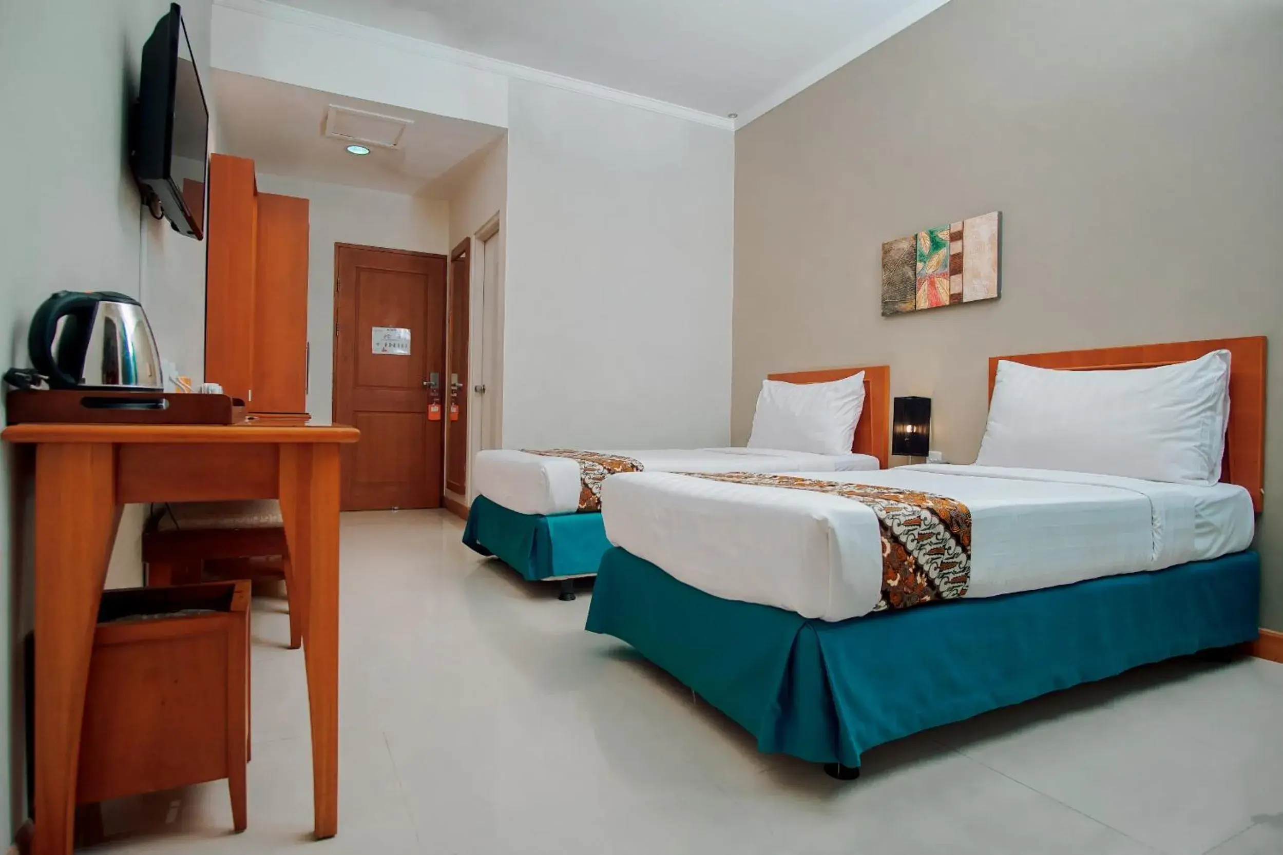 Bed in Sakanti City Hotel