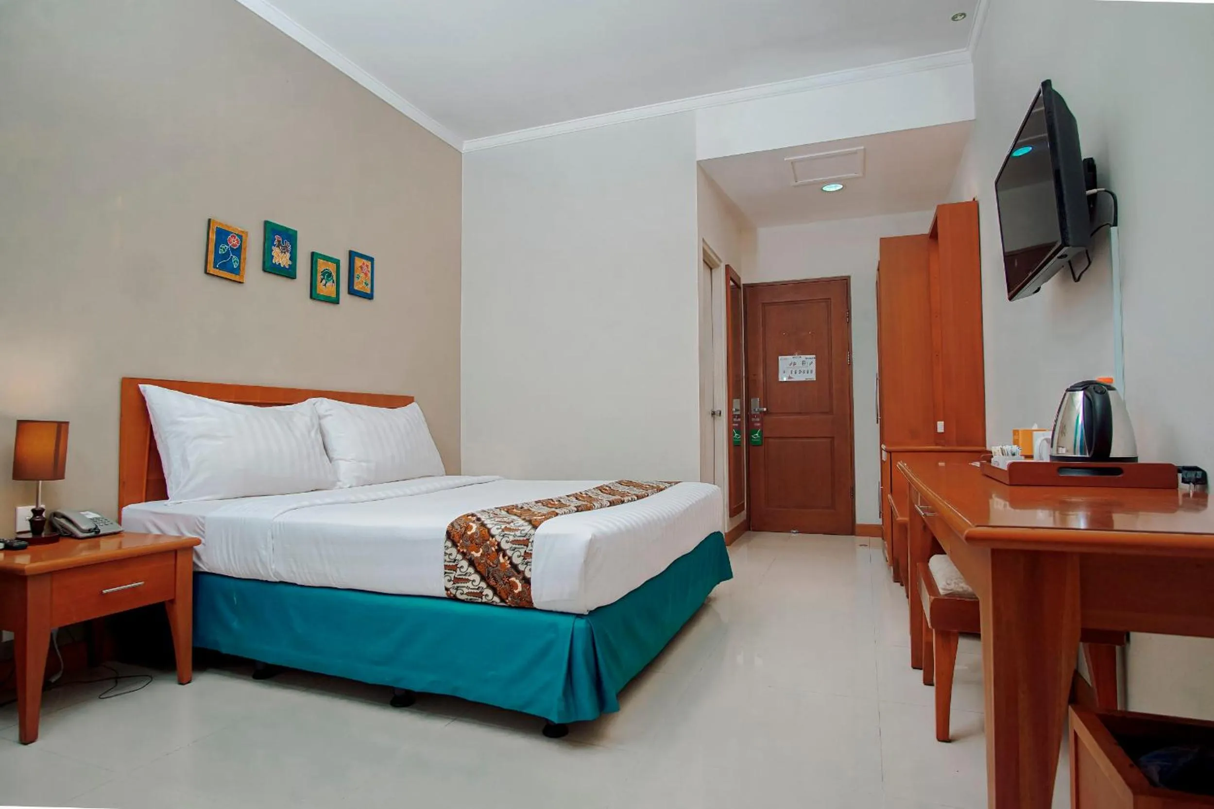 Bed in Sakanti City Hotel