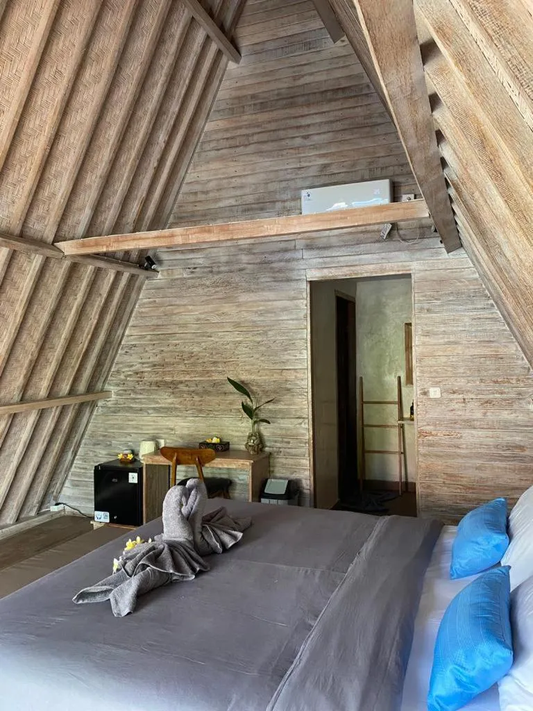 Bed in Kuri Garden Cottage