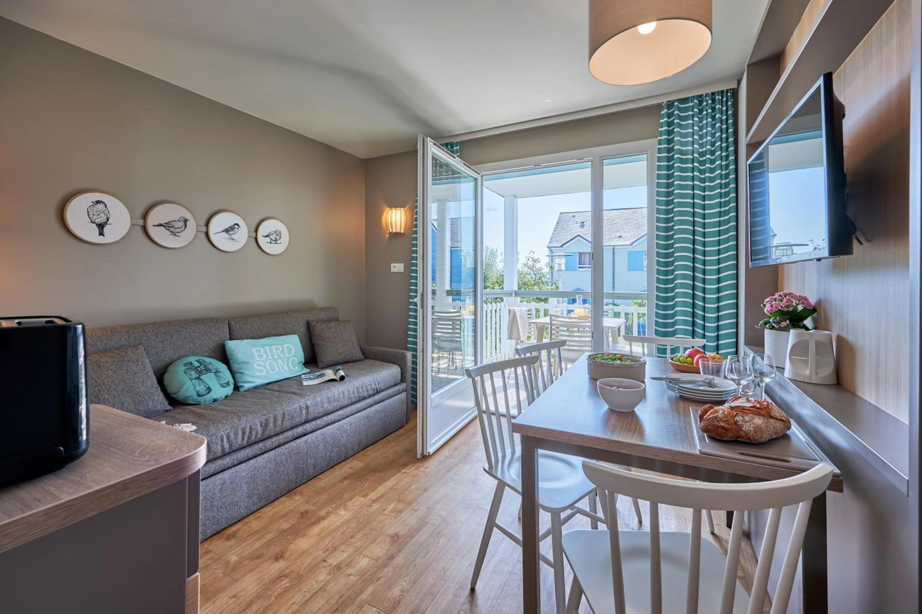 Communal lounge/ TV room in Pierre & Vacances Résidence Le Chant des Oiseaux