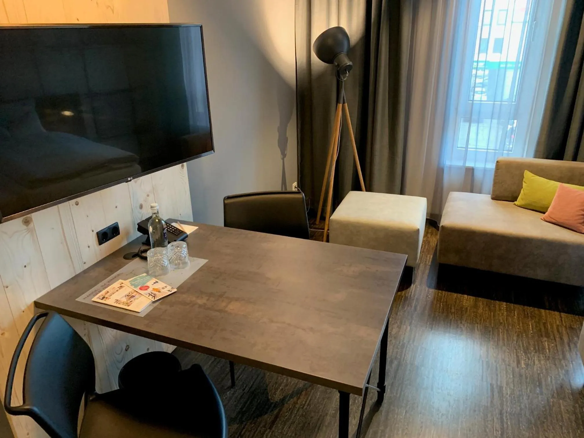 Living room in Vienna House Easy by Wyndham Bremen City Apartments