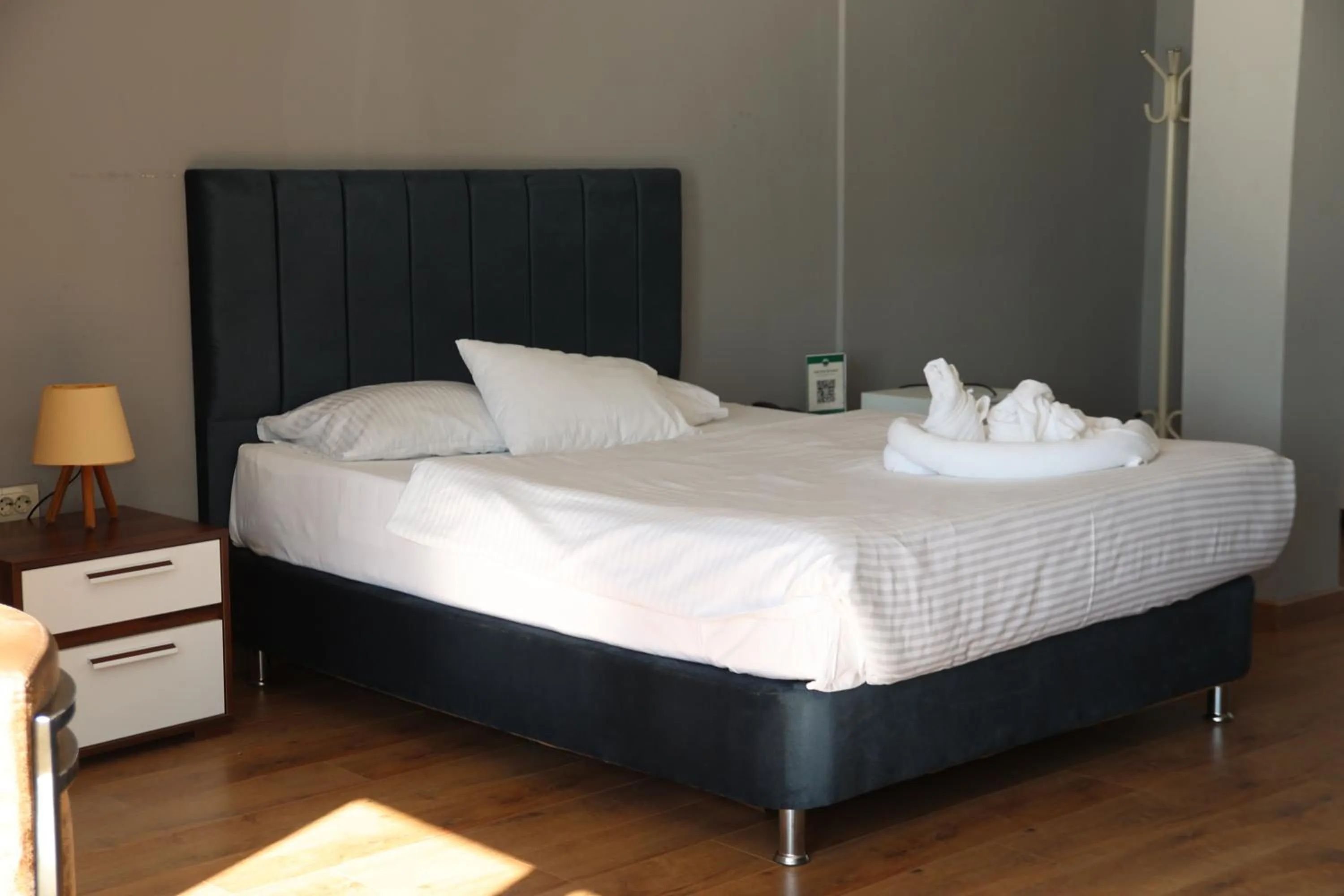 Bed in Grand Koru Hotel Beach