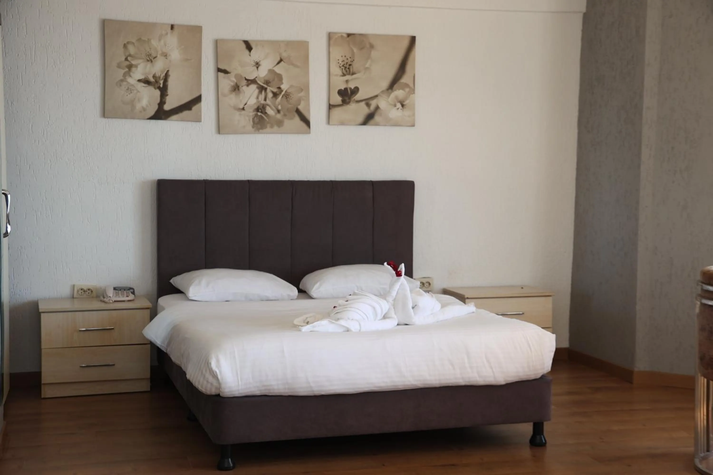 Bed in Grand Koru Hotel Beach