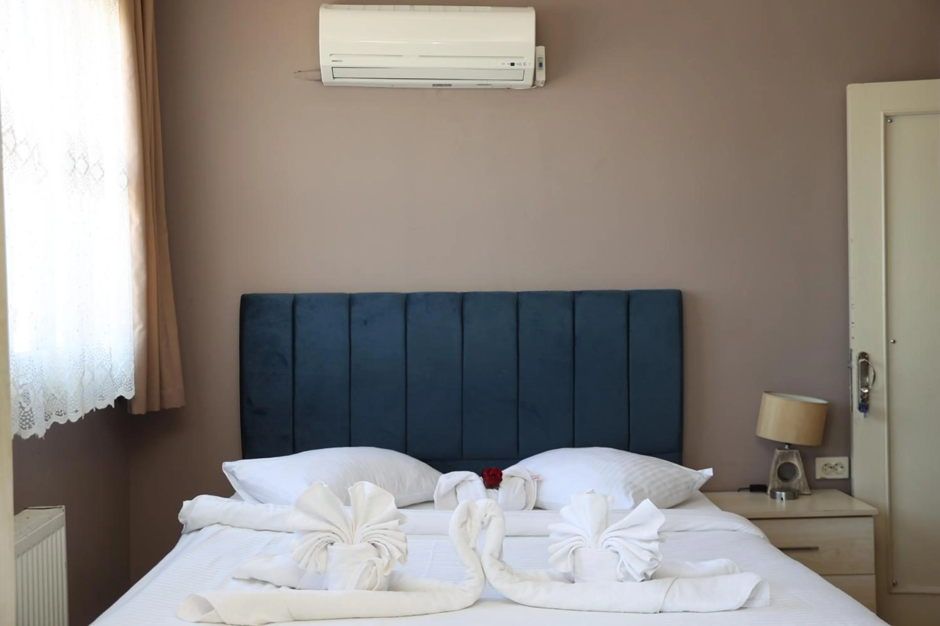 Bed in Grand Koru Hotel Beach