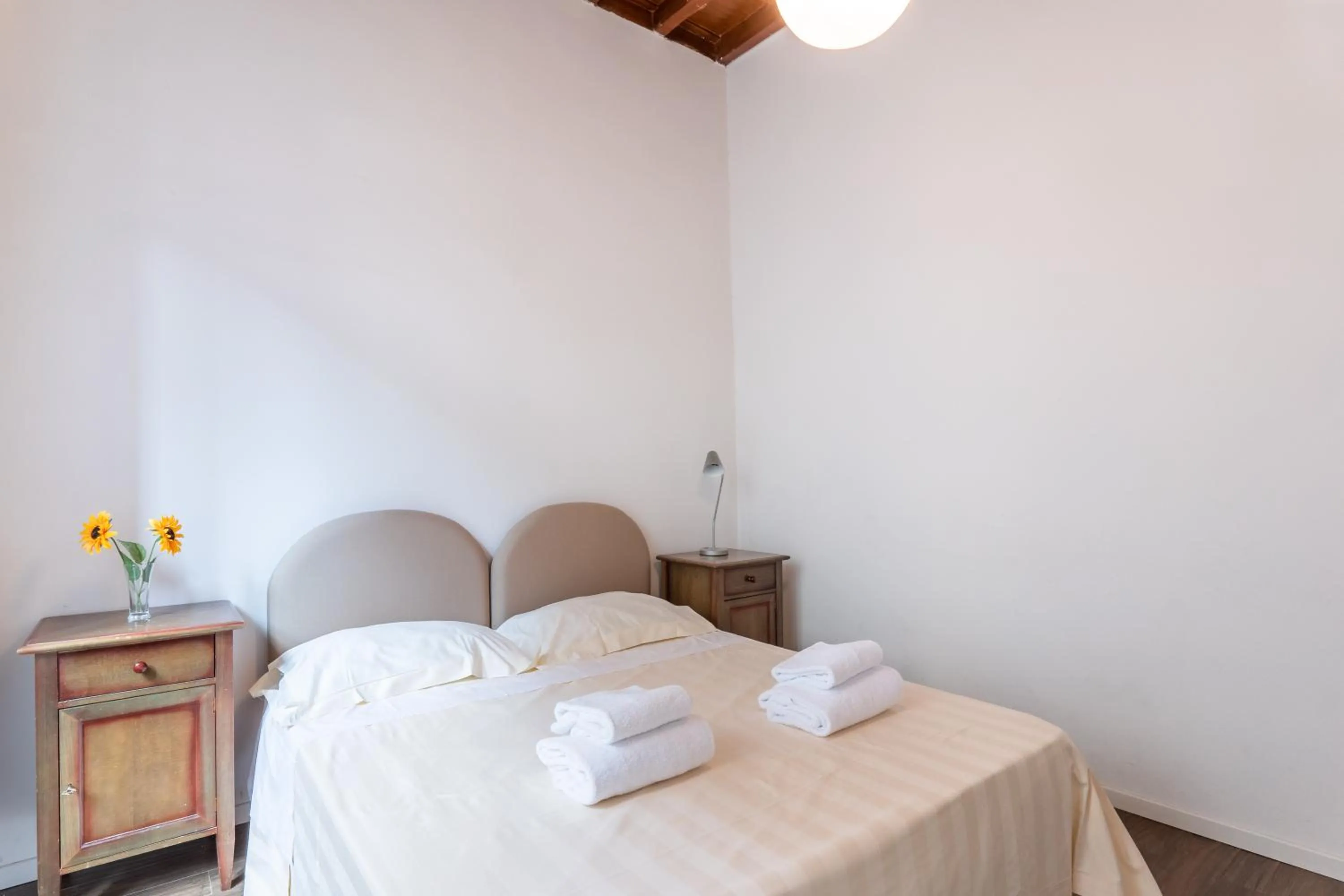 Bed in Palazzo Vecchio Apartments by Mmega