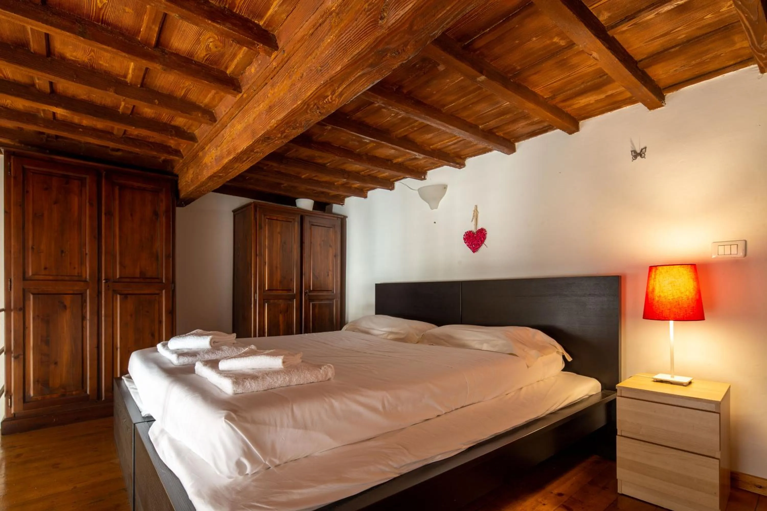 Bed in Palazzo Vecchio Apartments by Mmega