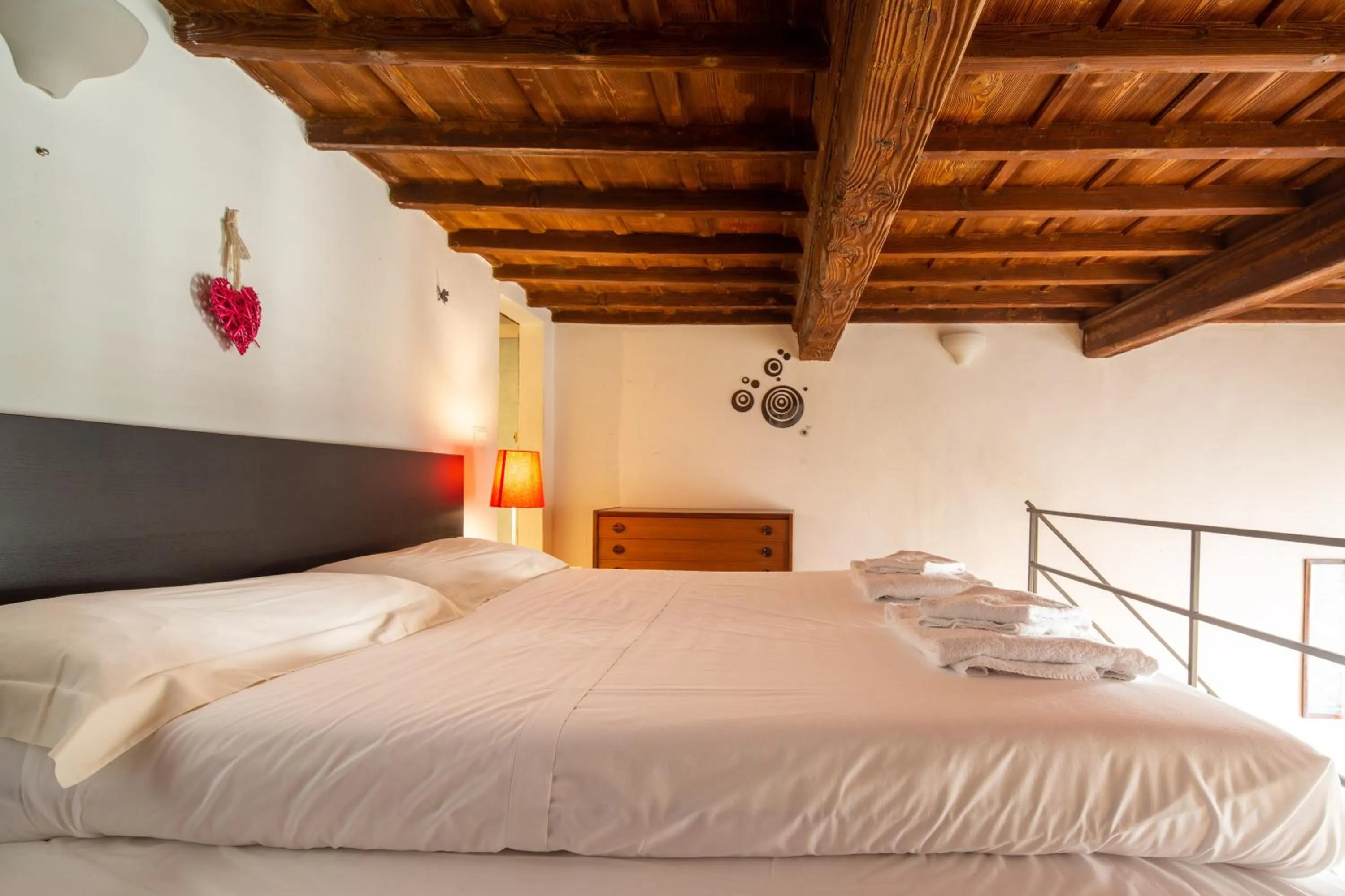 Bed in Palazzo Vecchio Apartments by Mmega