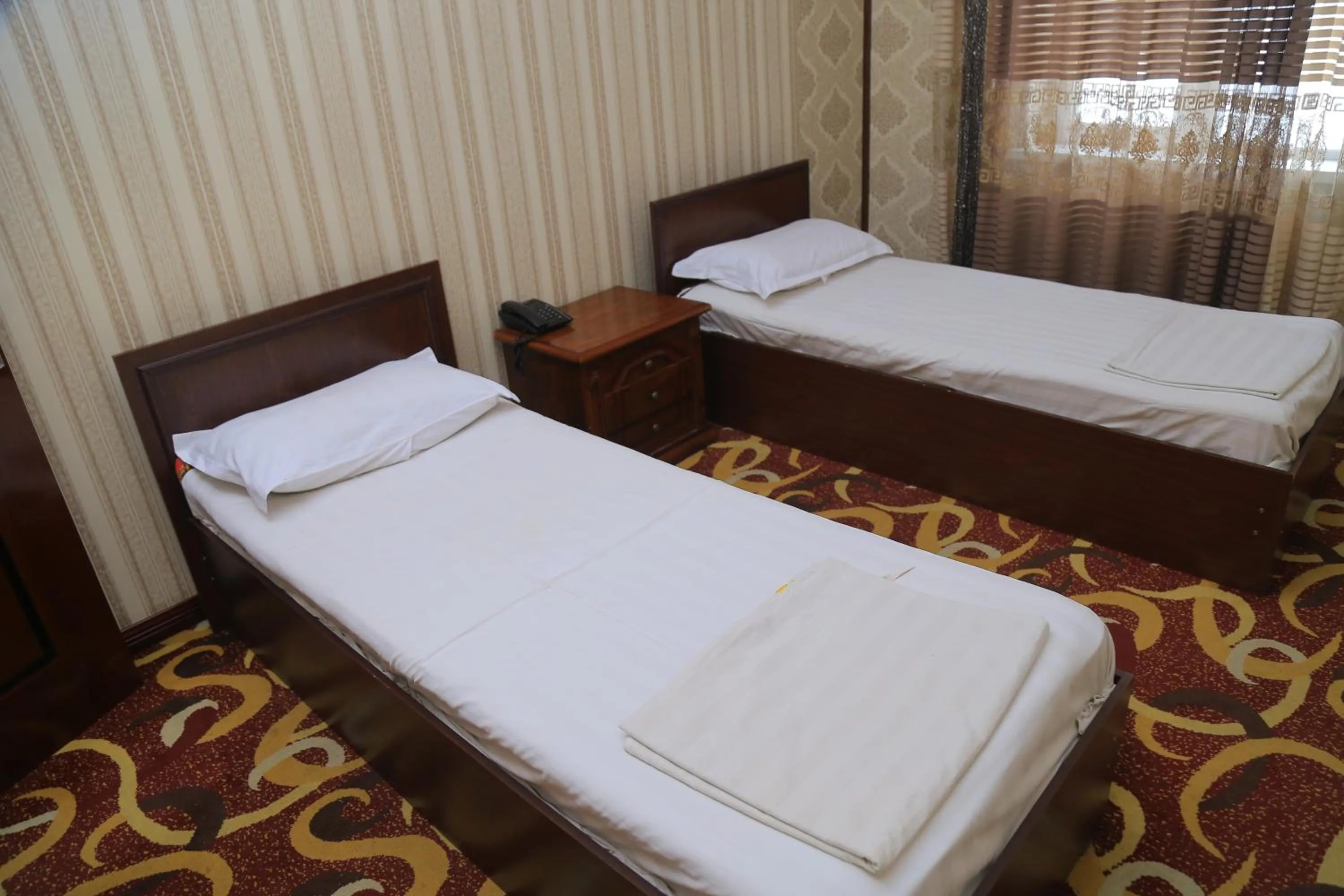 Bed in Dangara Hotel