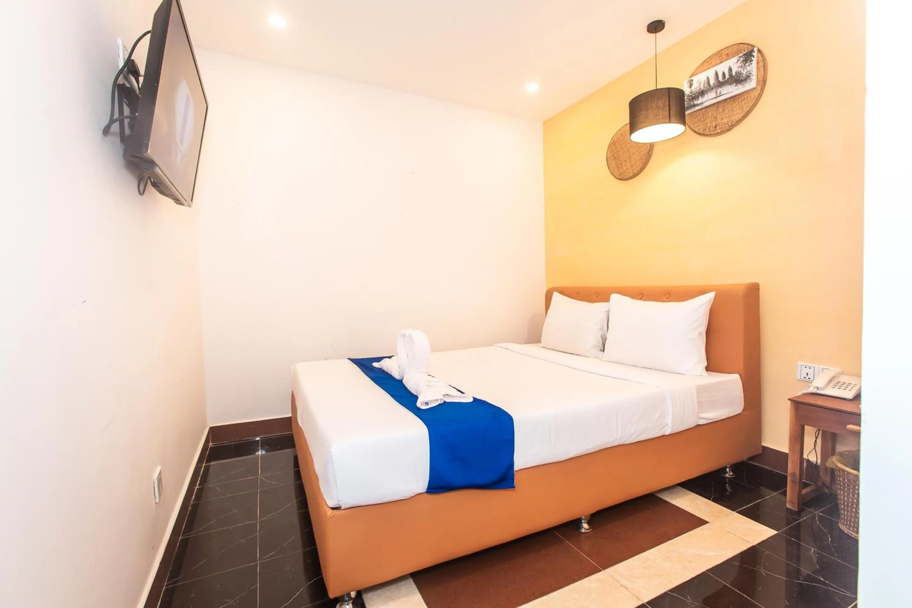 Bed in Grand Elevation Hotel