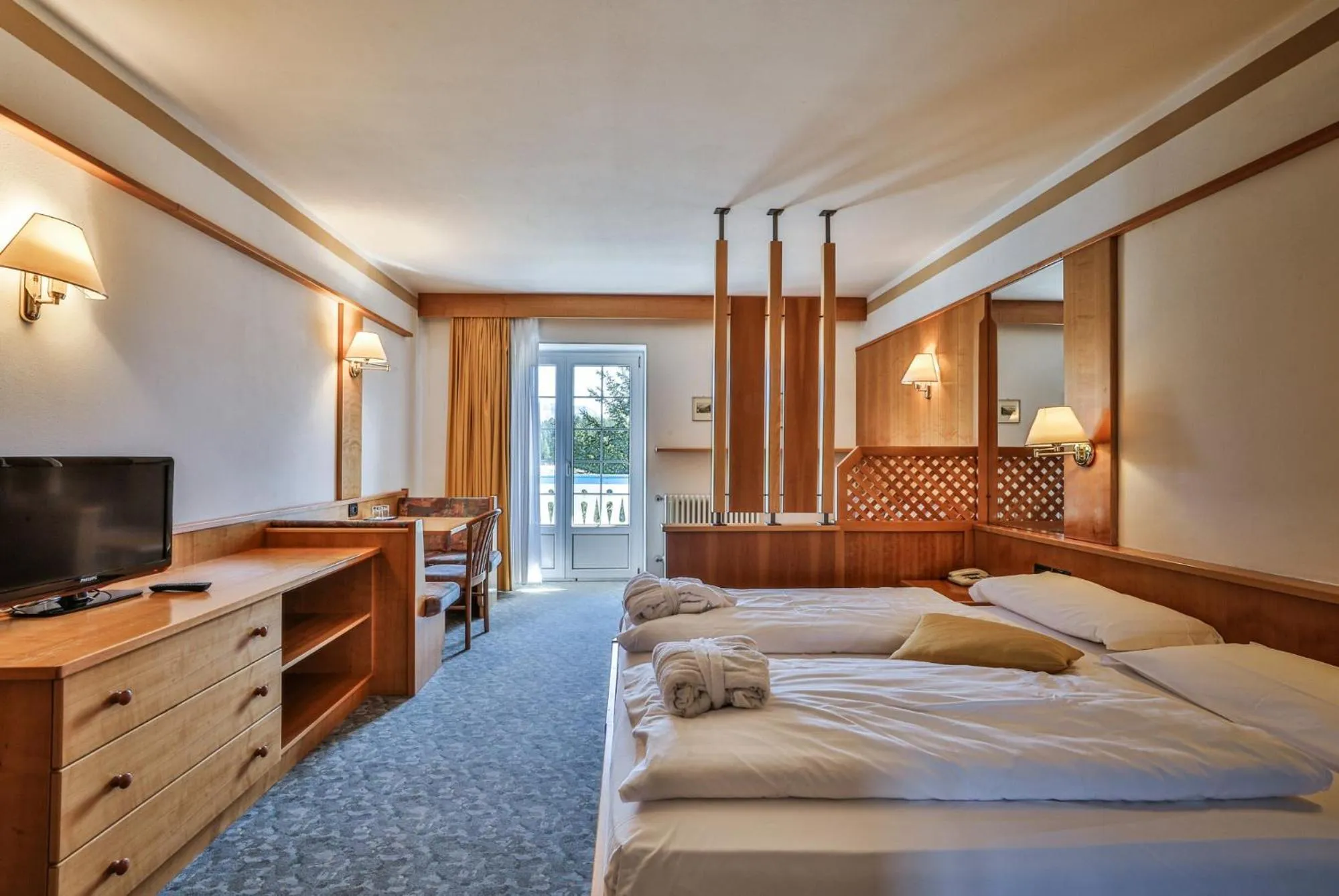 Bed in MyTime Hotels Savoy