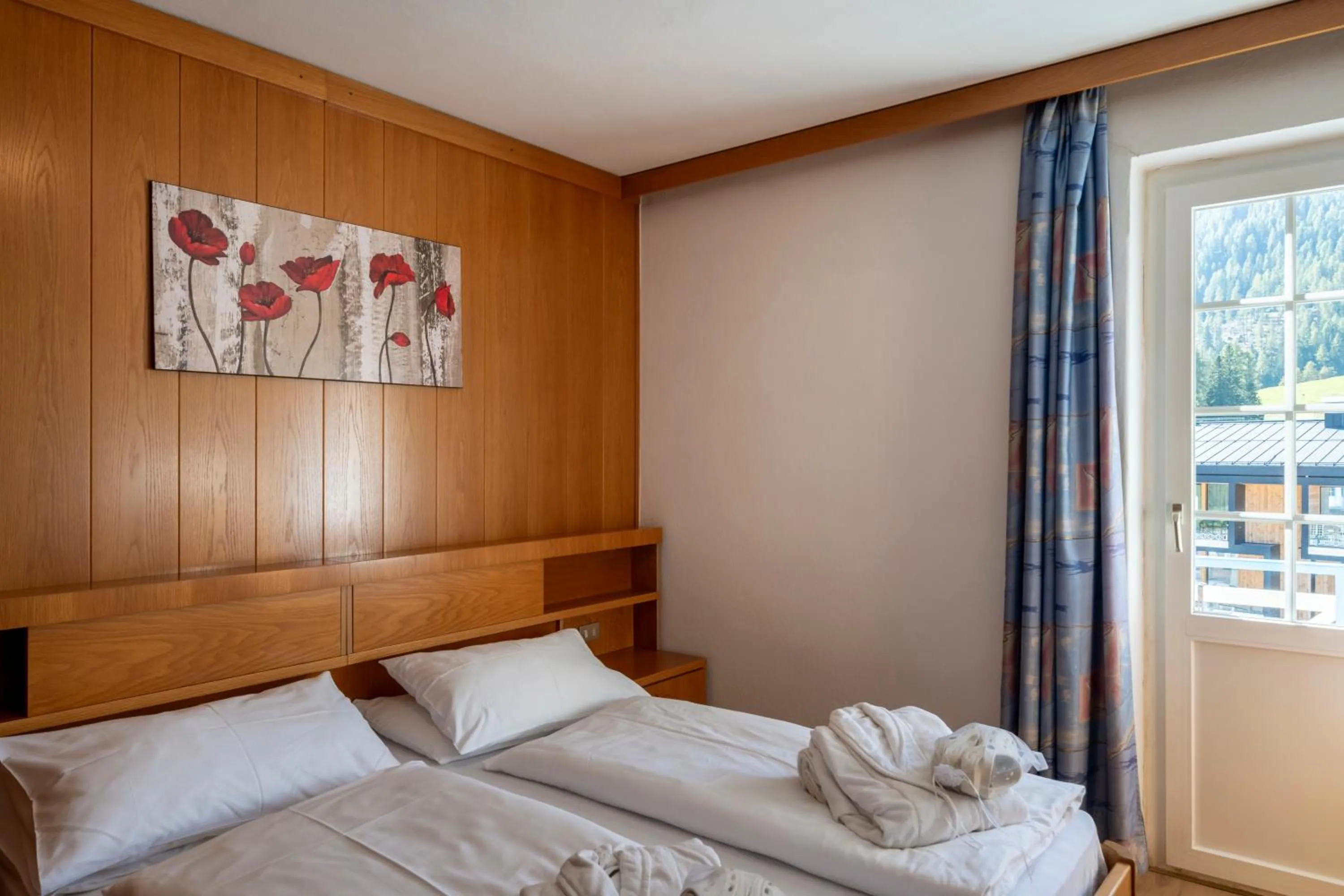 Bed in MyTime Hotels Savoy