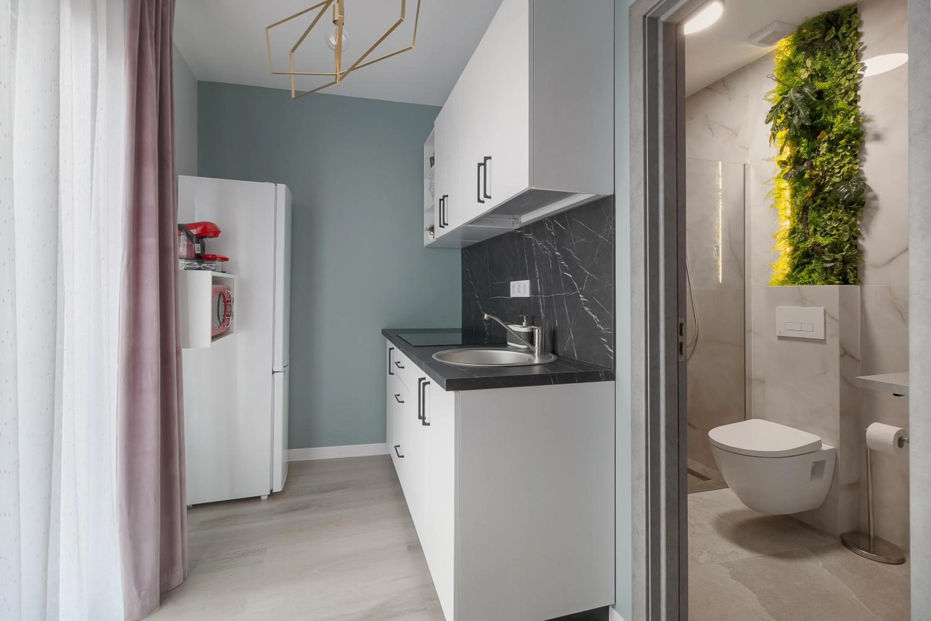 Kitchen or kitchenette in Aparthotel Aria Boutique