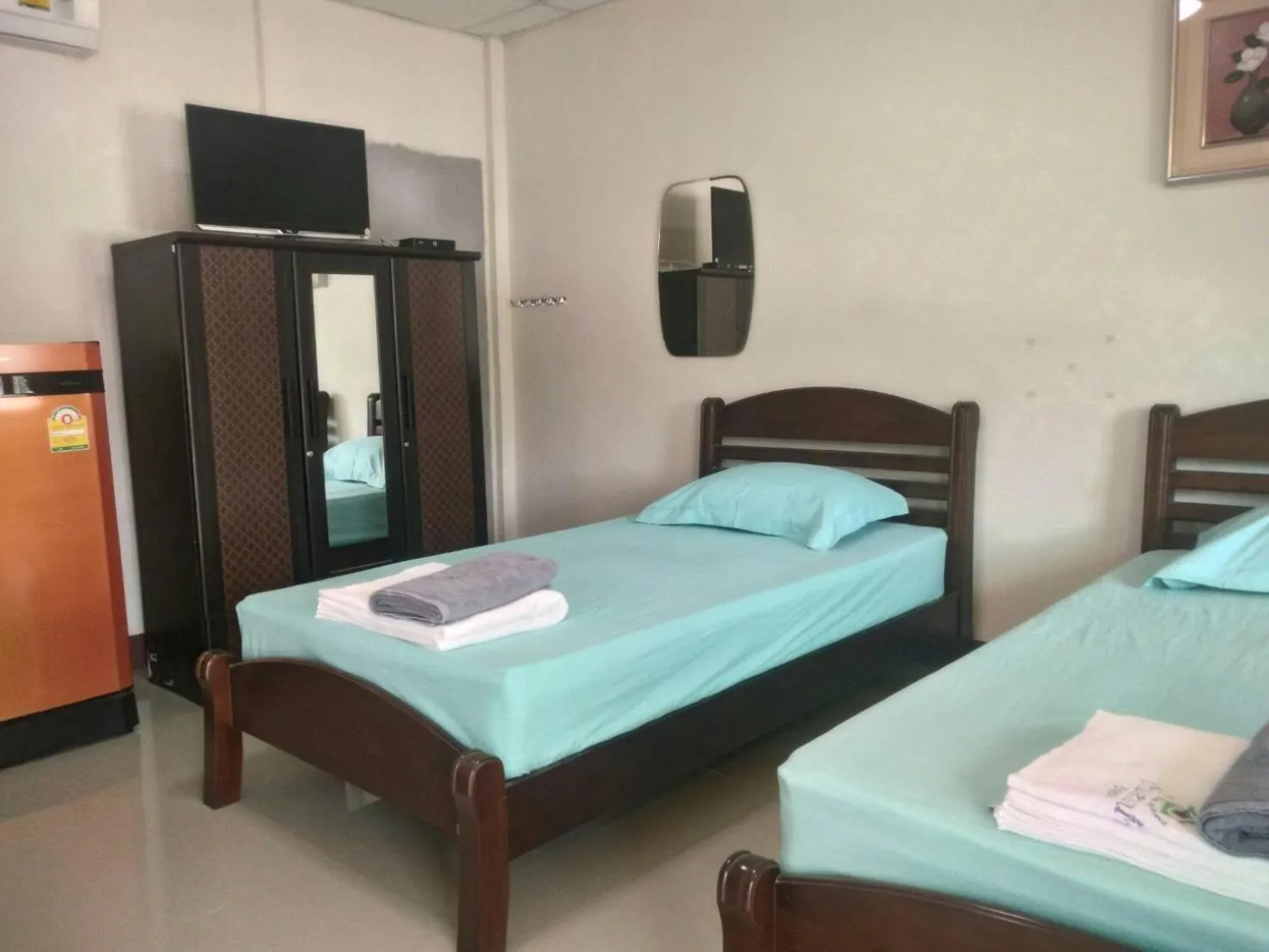 Bed in Baan Suan Nam Resort