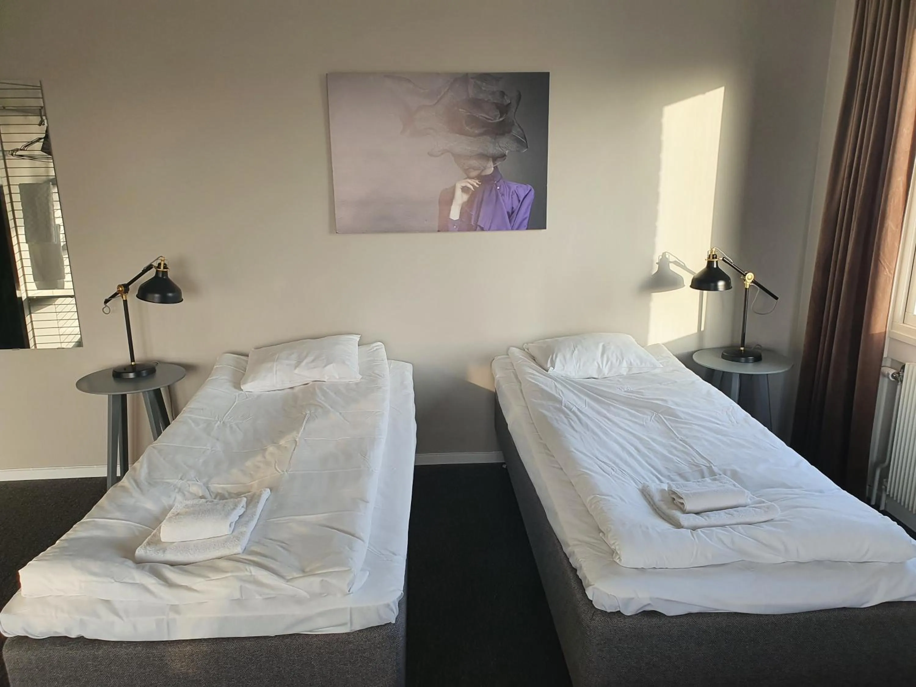 Photo of the whole room, Bed in BriQ Hotell