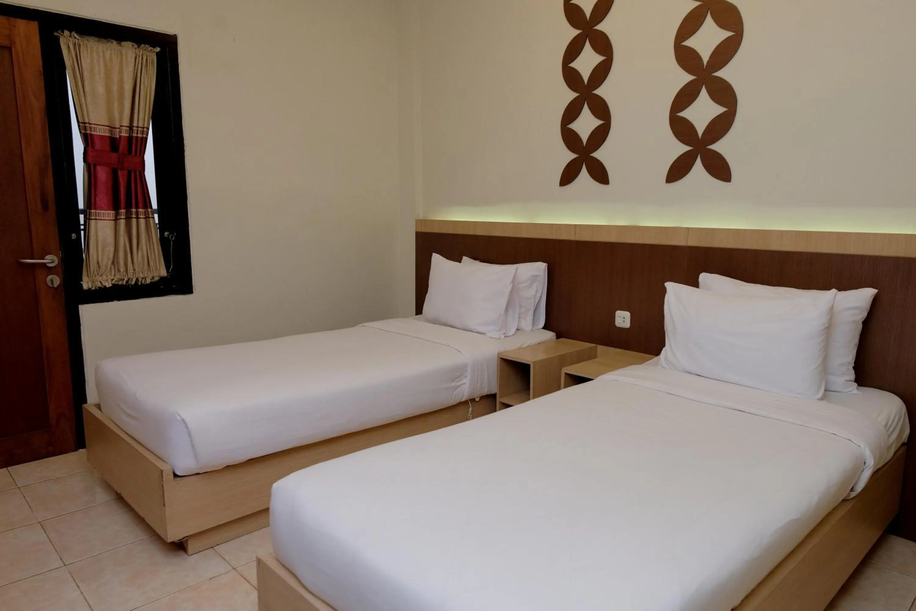 Bed in Mawar Asri Hotel